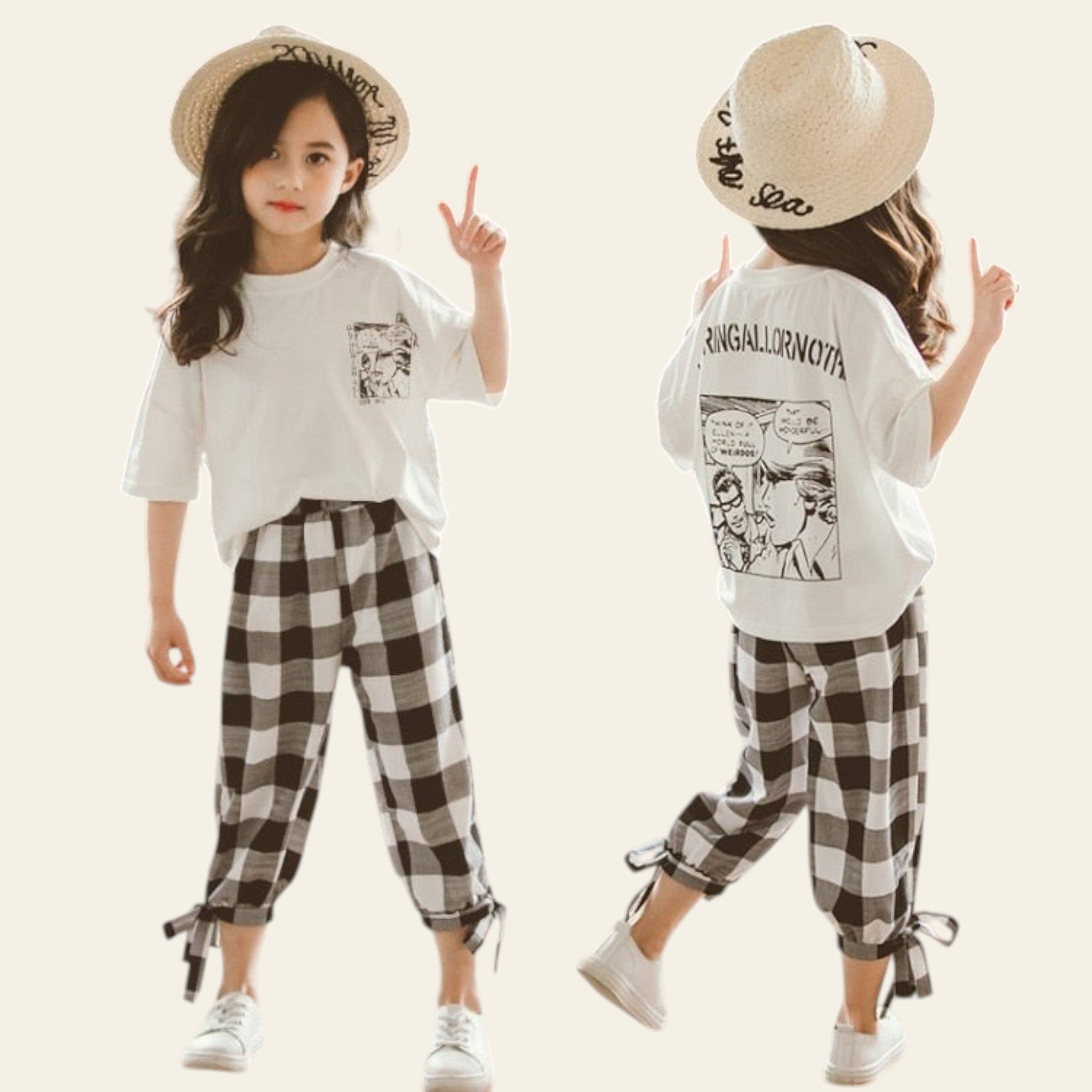 Two children wearing matching outfits with white t-shirts and plaid pants, standing outdoors.
