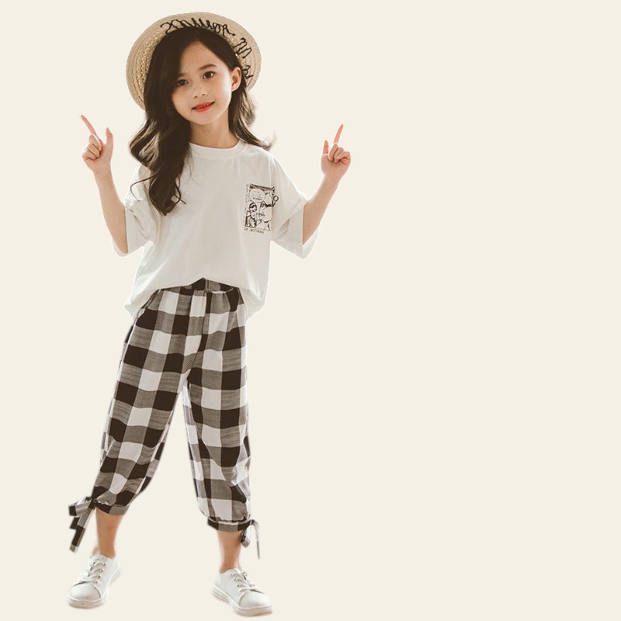 Child wearing a white t-shirt and checkered pants with a matching outfit displayed.