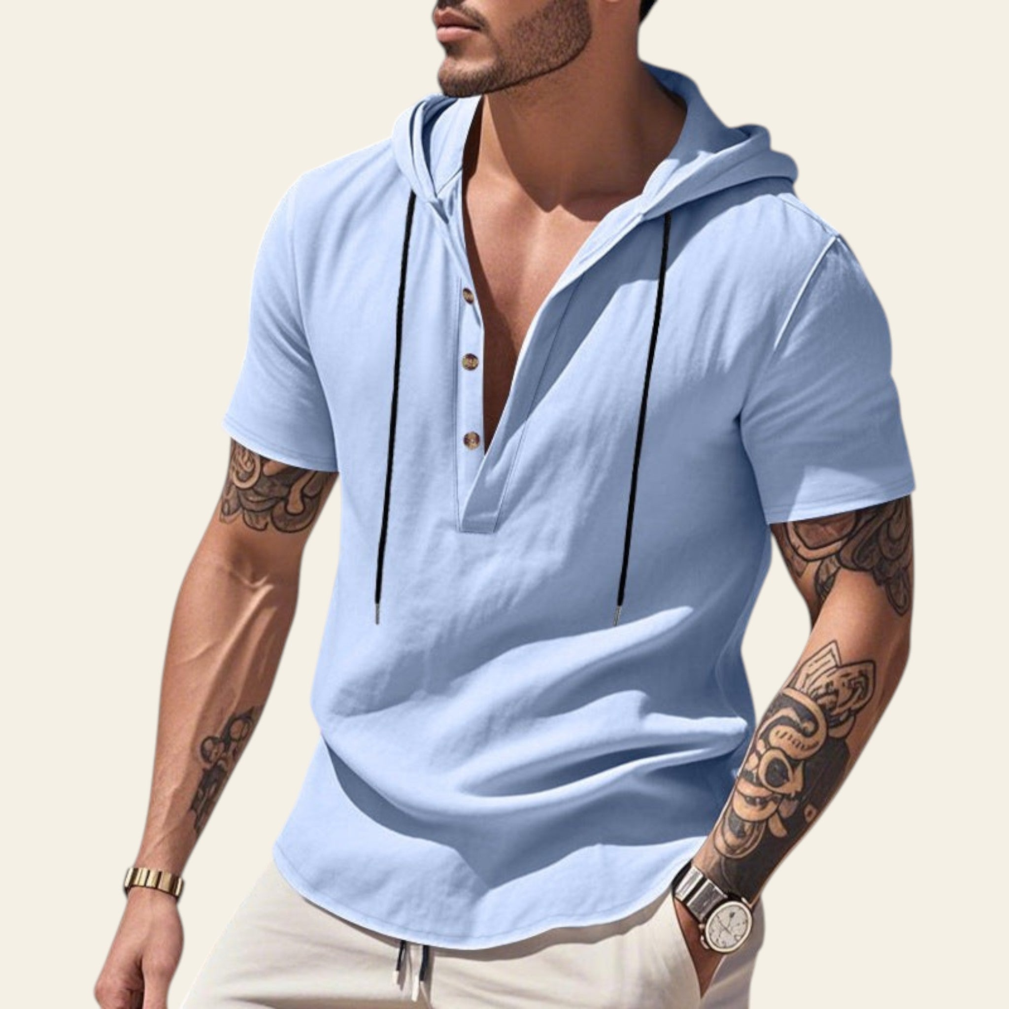 Man wearing a light blue breathable linen hooded short sleeve henley shirt at the beach