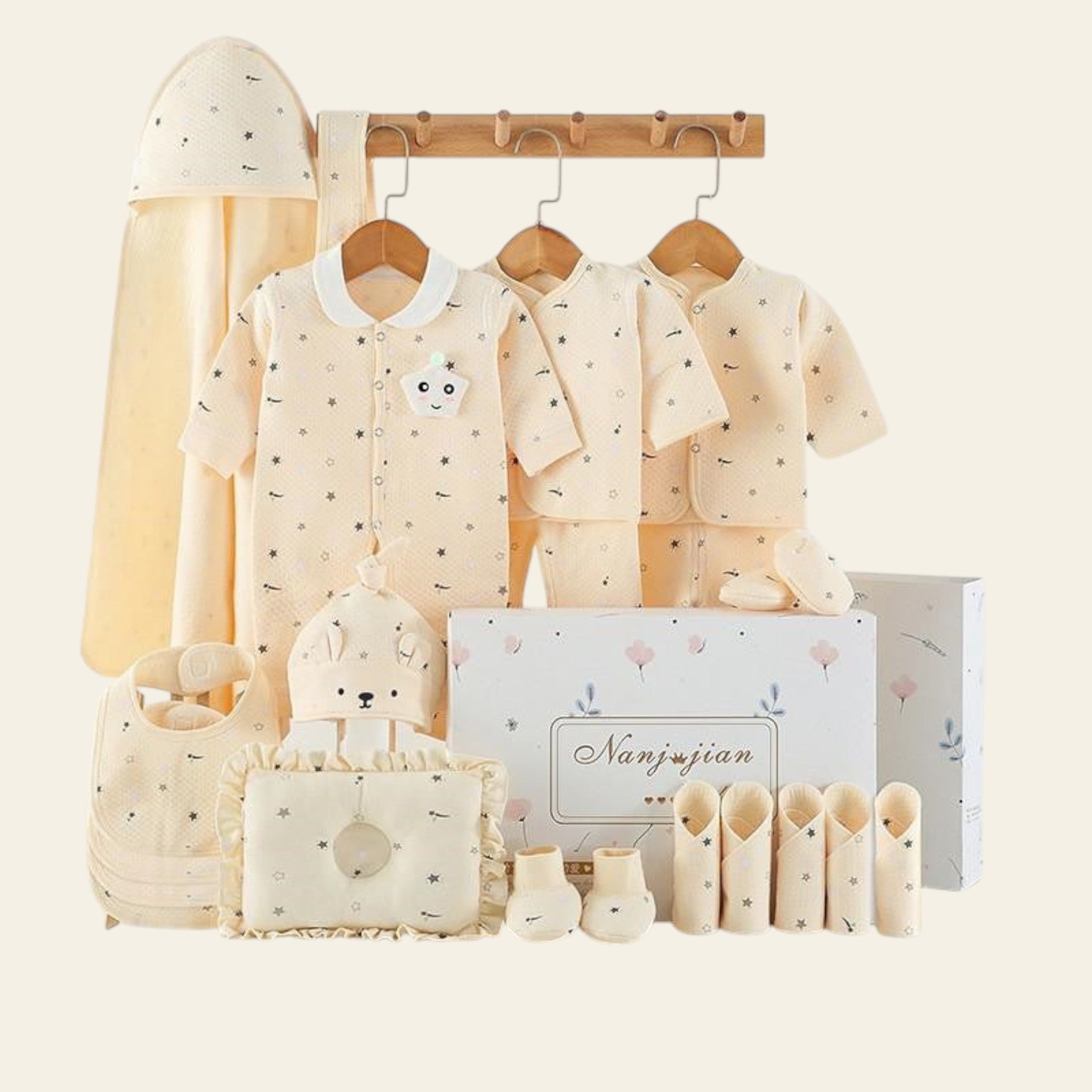 Collection of baby clothing and accessories on a white background with 'warm' text.