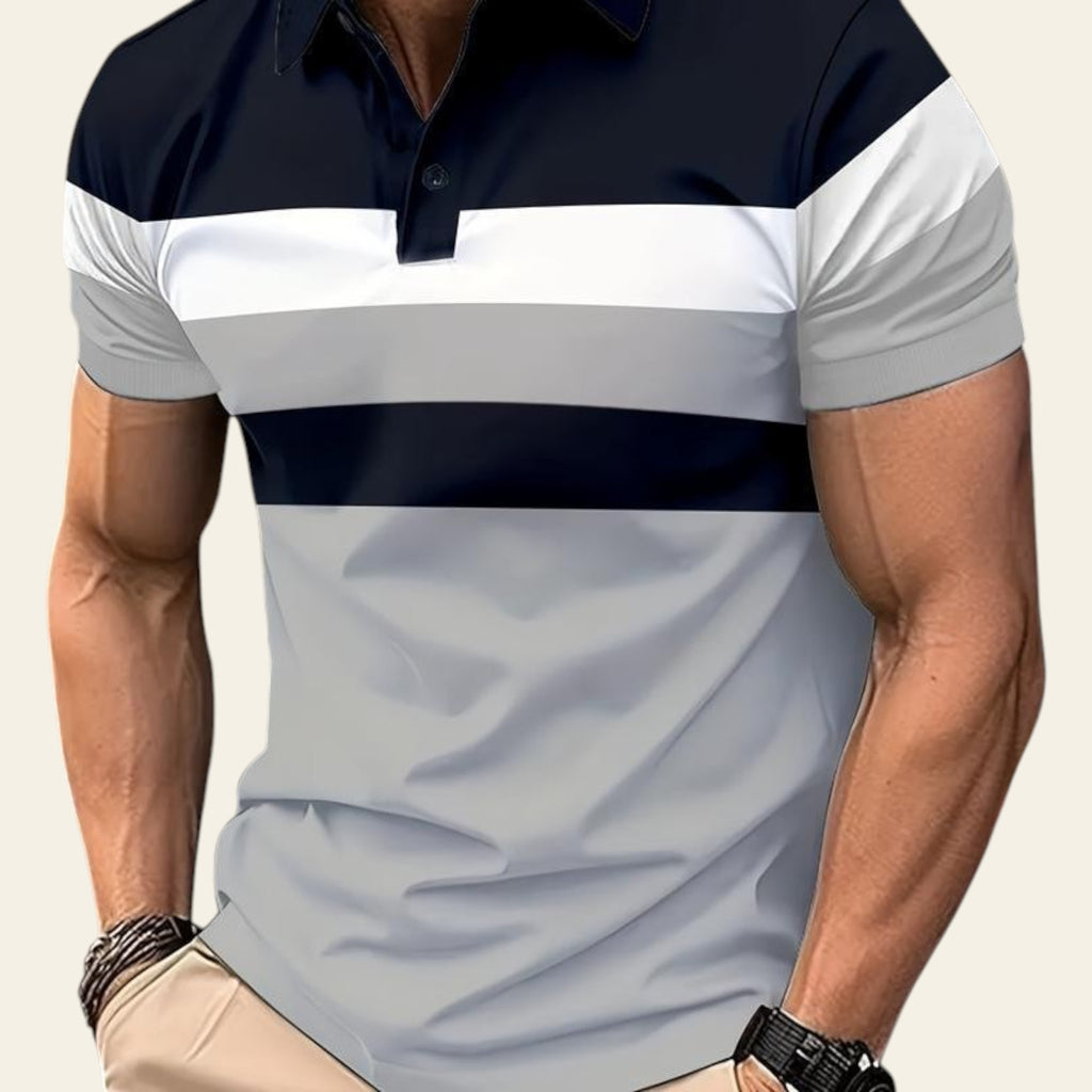 Man wearing a light blue polo shirt with gray, and black horizontal stripes on a city street