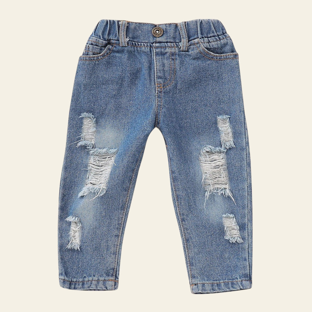 Distressed blue jeans on a white background