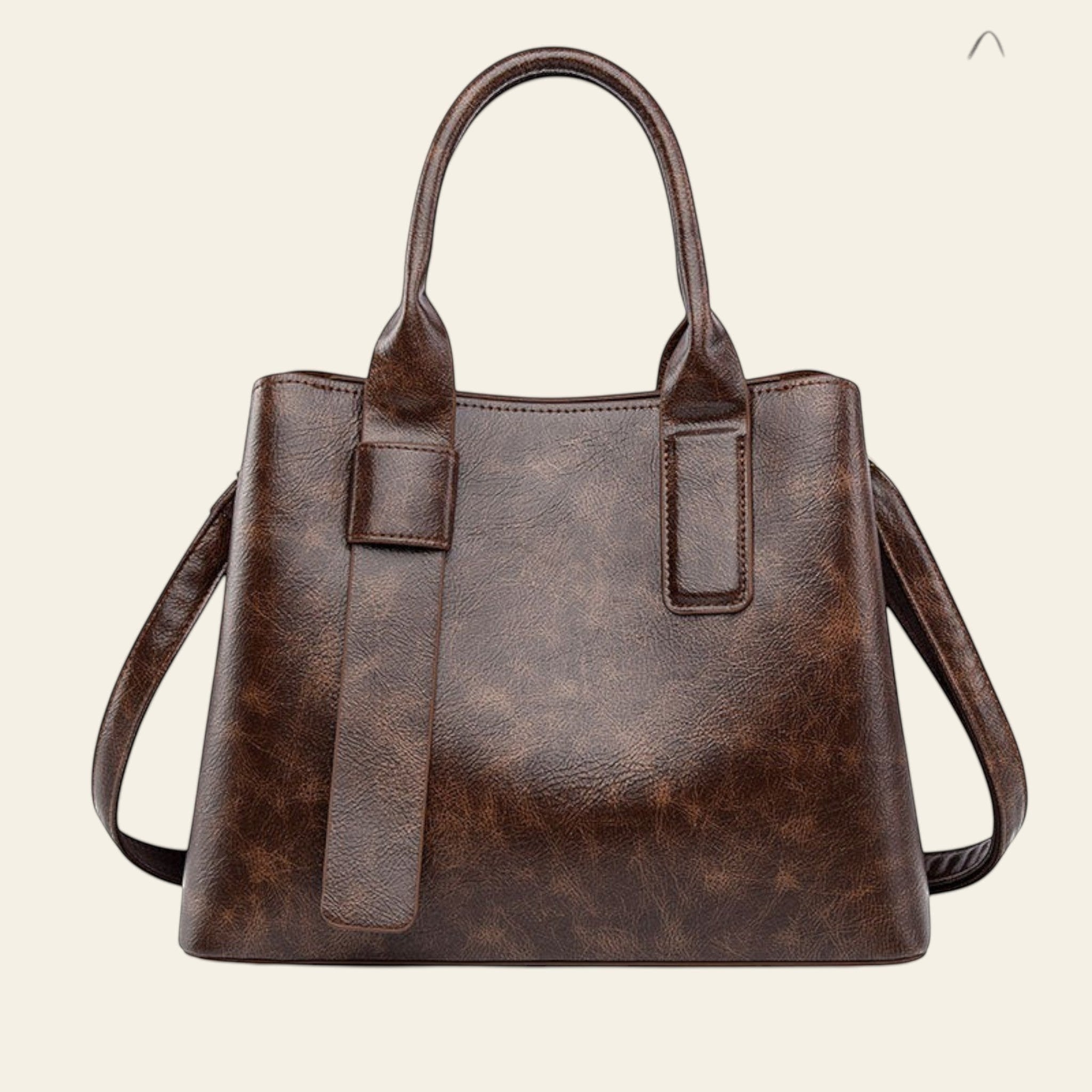 Brown leather handbag with a matching shopping bag on a white background