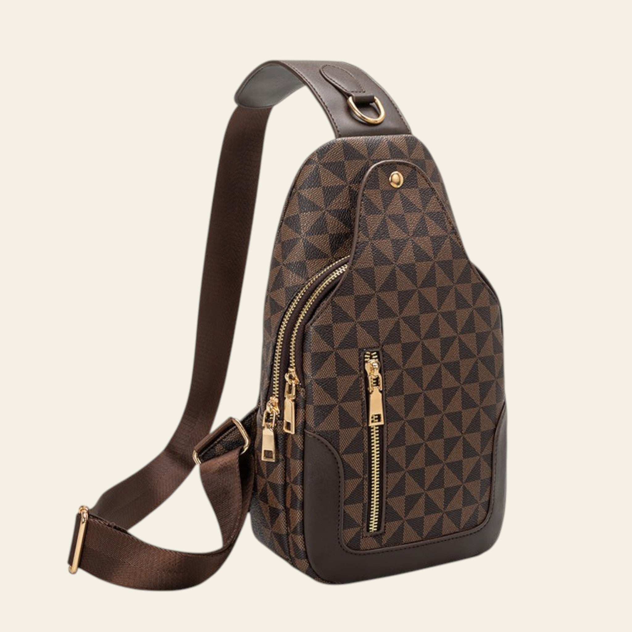 Brown patterned sling bag with gold zippers on a white background