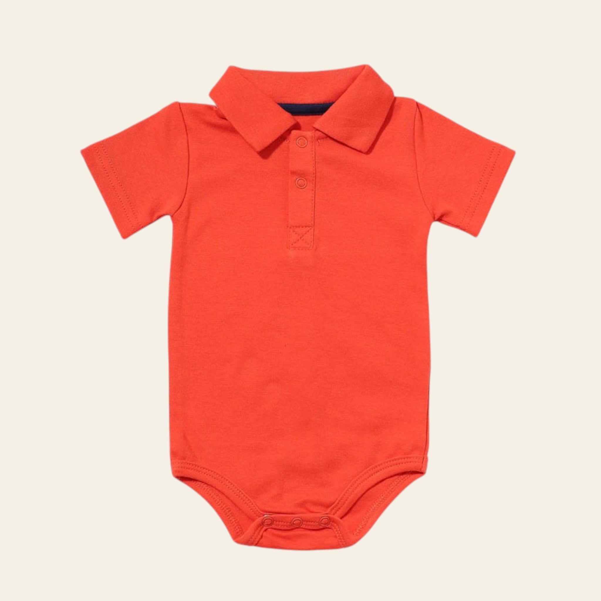 Orange baby bodysuit with collar on a white background