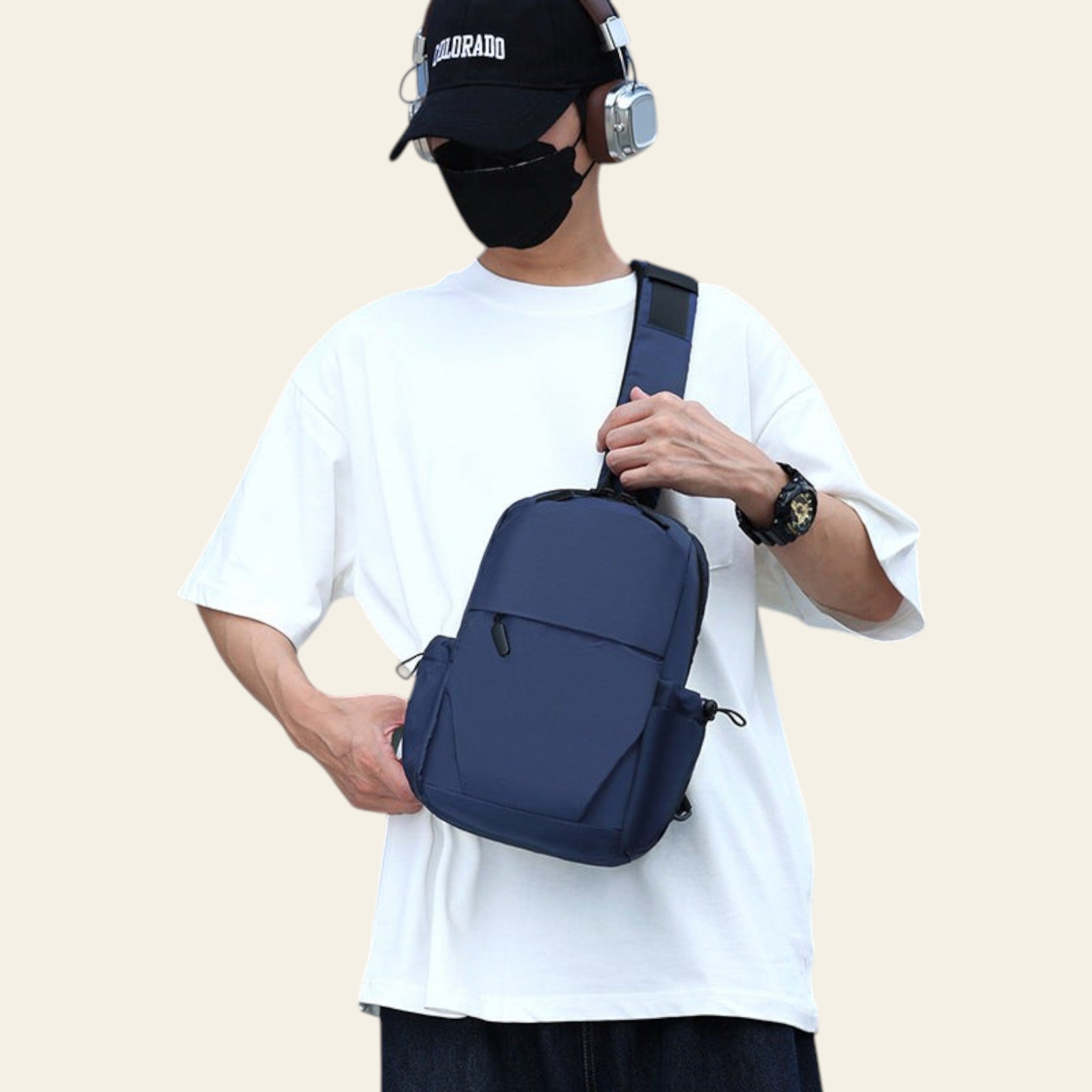 Person wearing a navy blue backpack outdoors with a building in the background