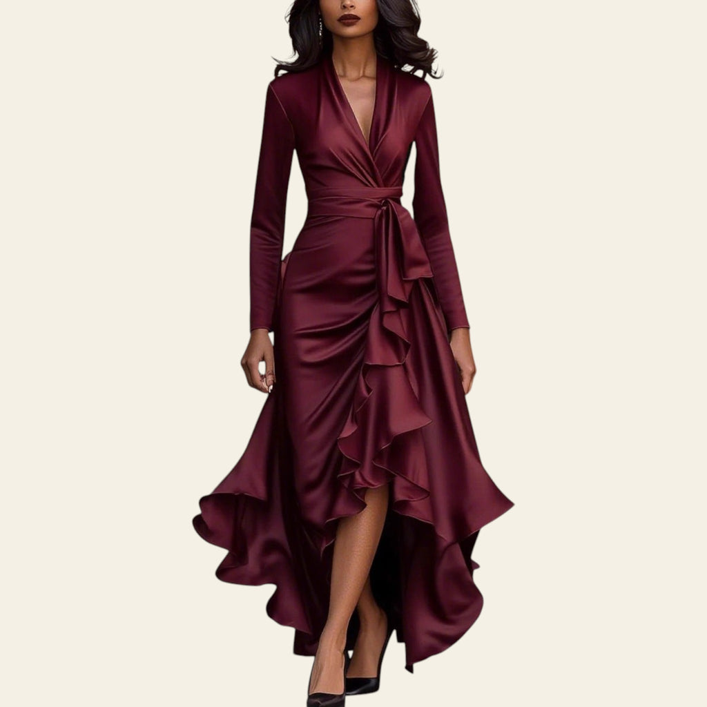 Woman wearing a wine red satin V-neck ruffled hem dress walking on a city street