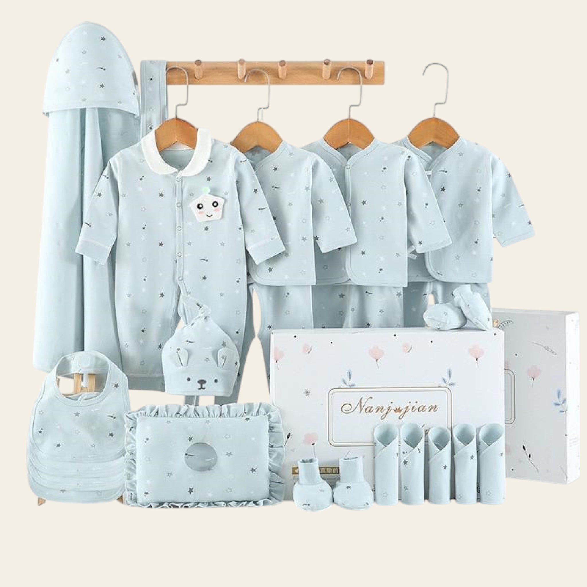 Collection of baby clothing and accessories with 'warm' text on a white background
