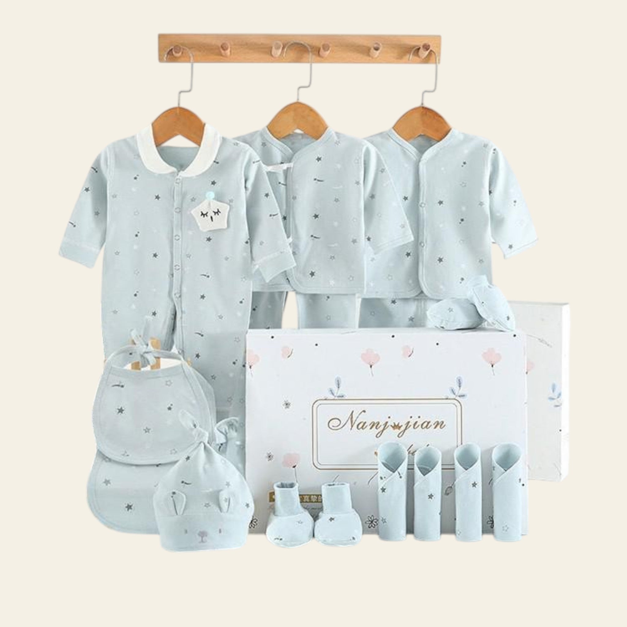 Baby clothing set with baby shoes and hat on a white background