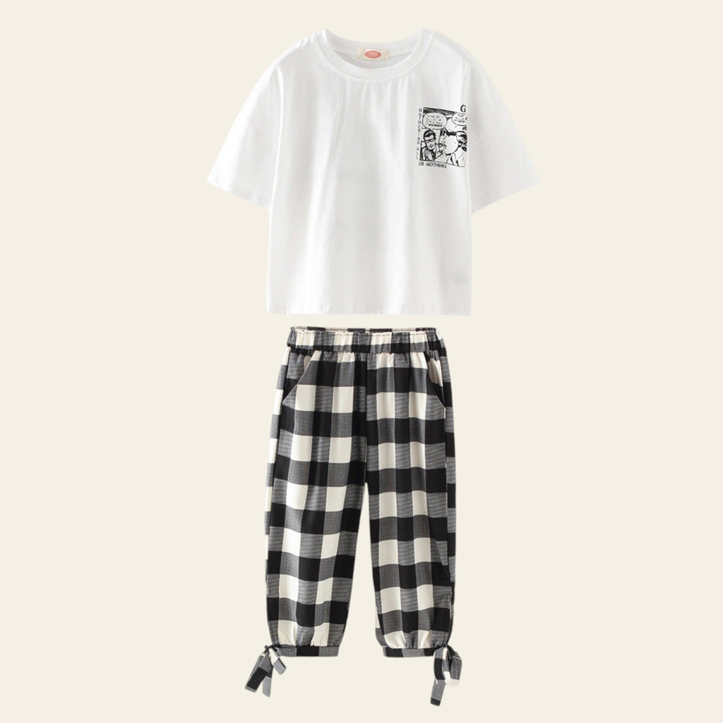 White t-shirt with graphic design and black and white checkered pants on a white background