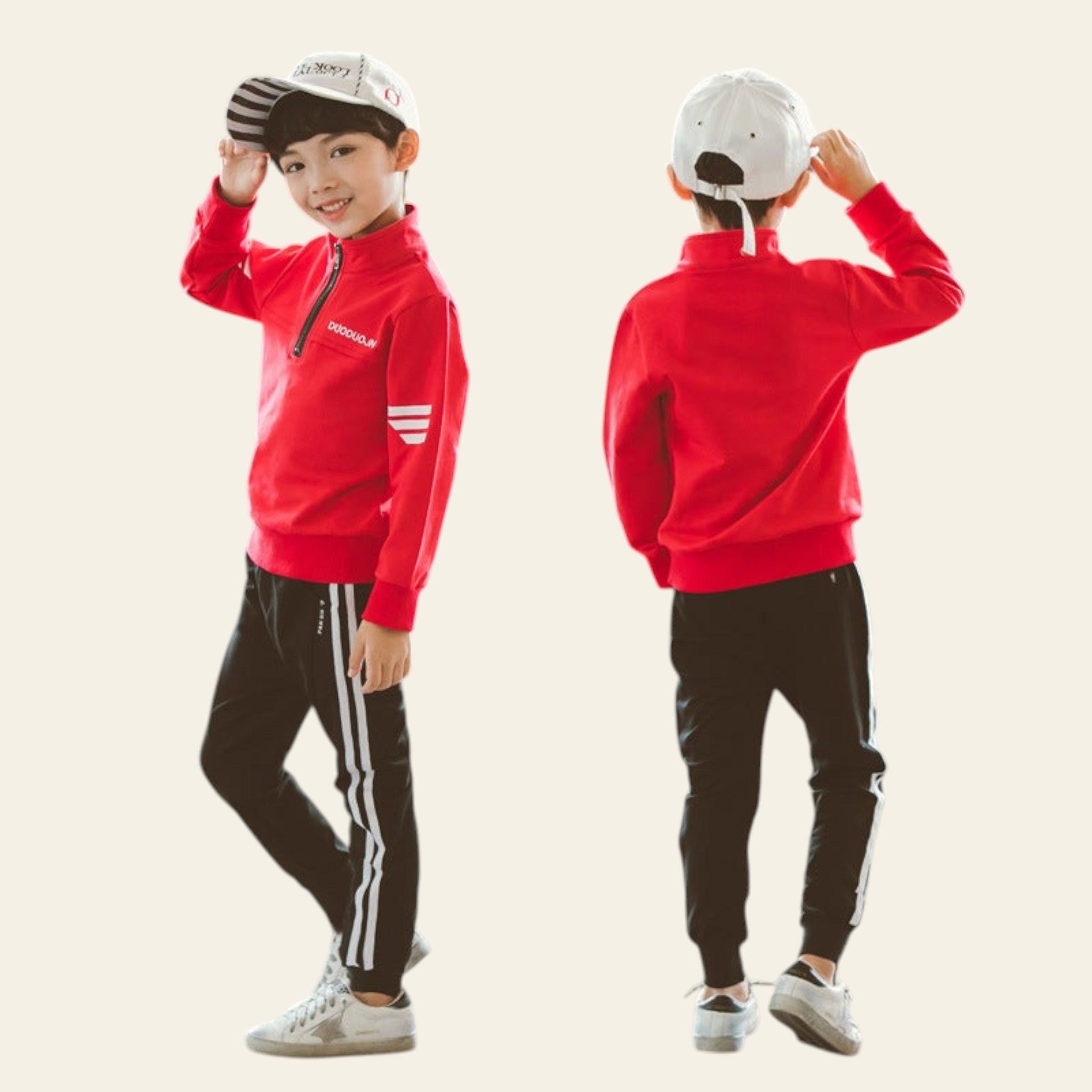 Child wearing a red jacket and black pants with white stripes, standing against a plain background.