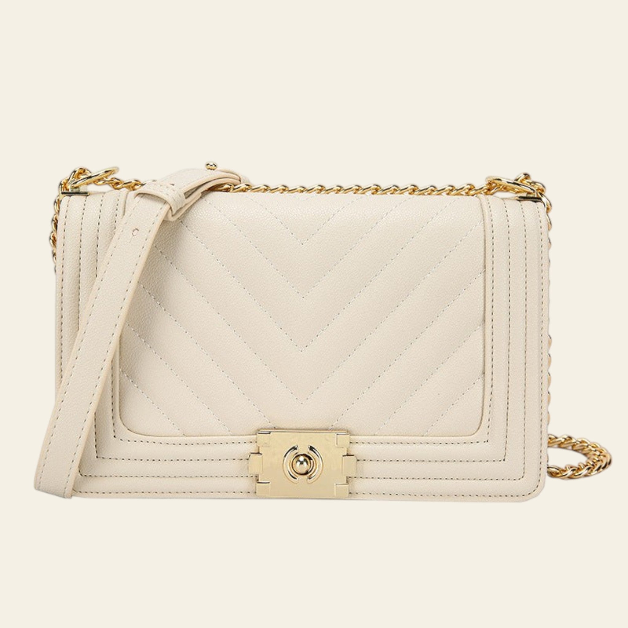 White quilted handbag with gold chain and clasp on a white background