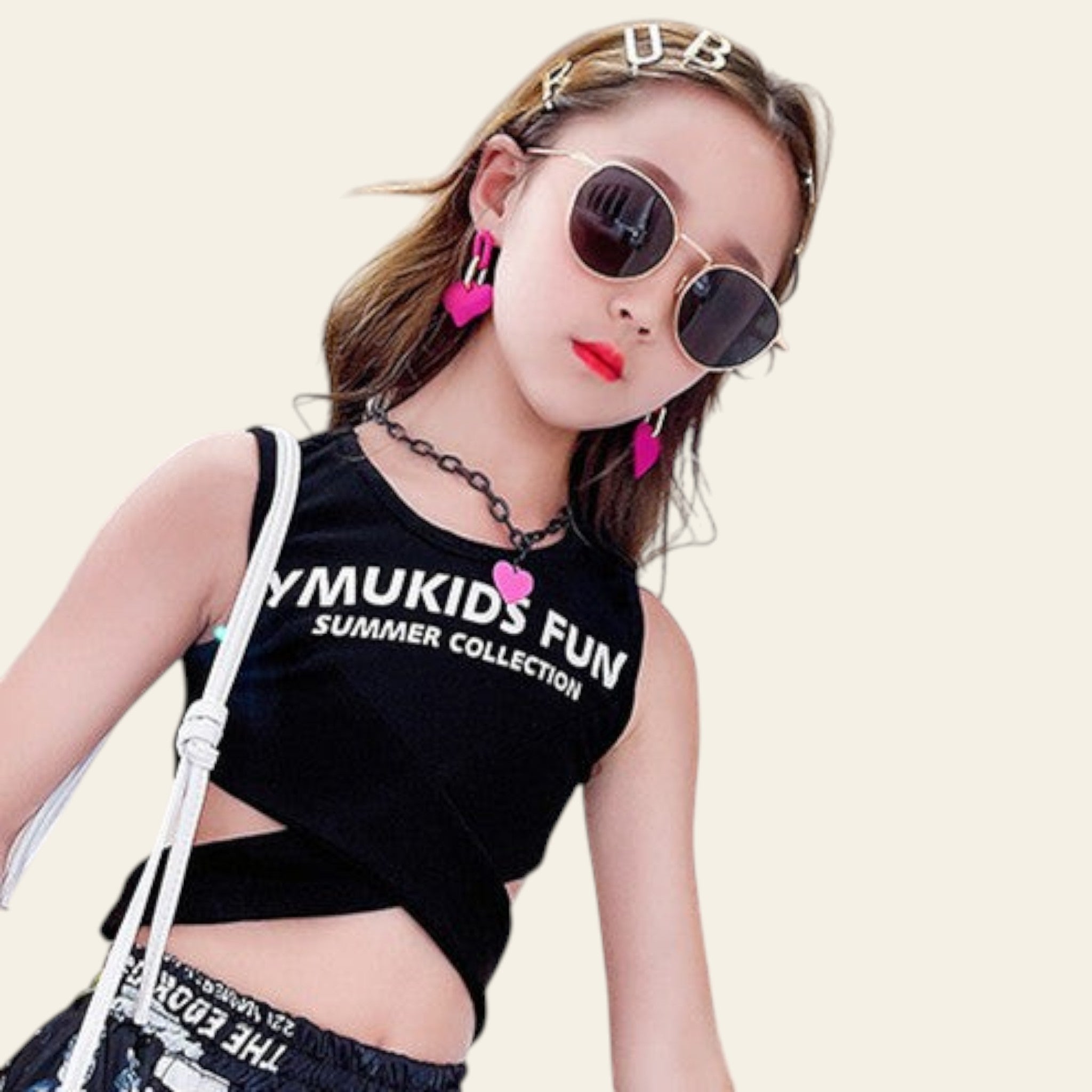 Girl wearing black sleeveless summer top with printed text and sunglasses