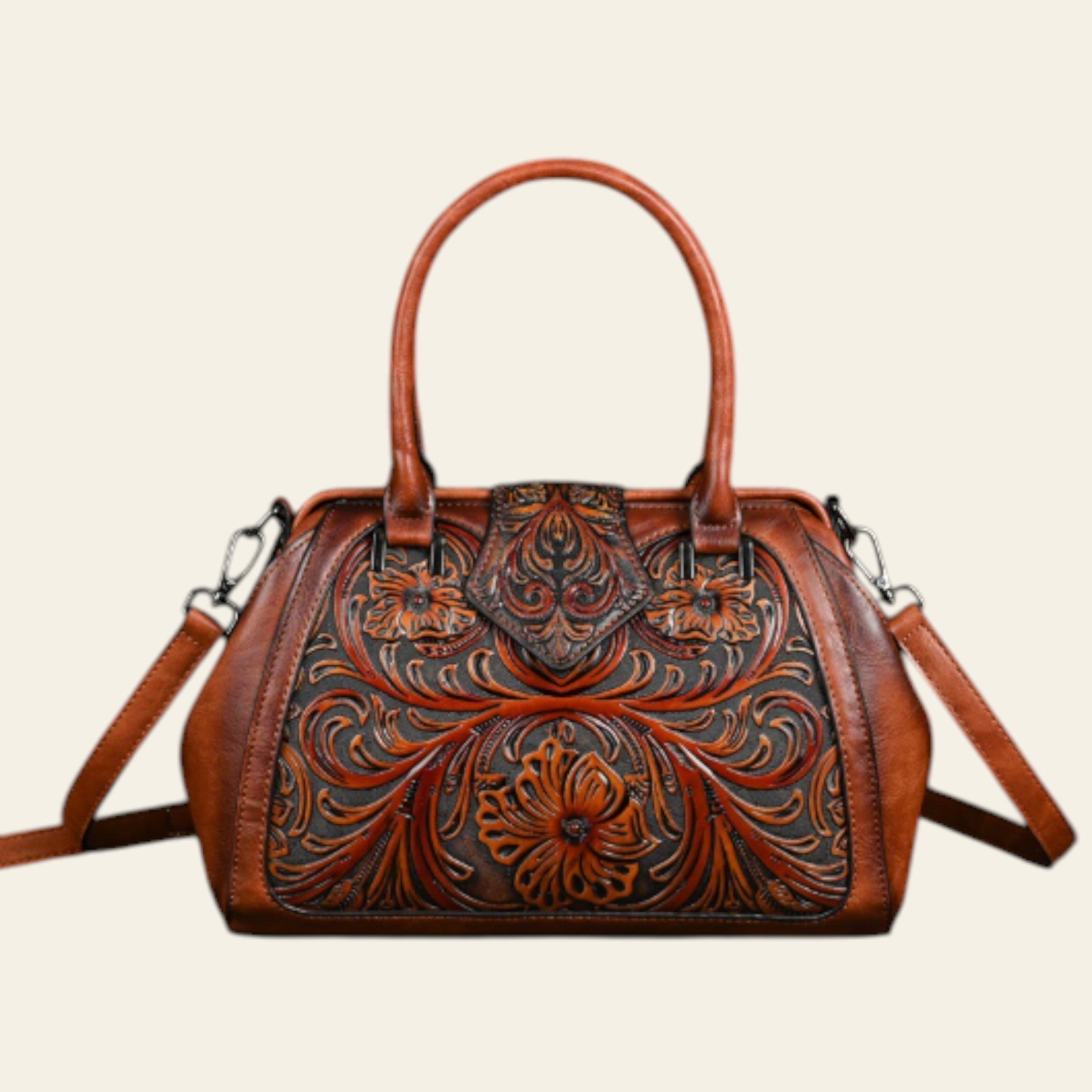 Brown leather handbag with intricate floral patterns on a dark background