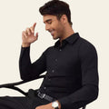 Man wearing a black long sleeve men's shirt, casual style