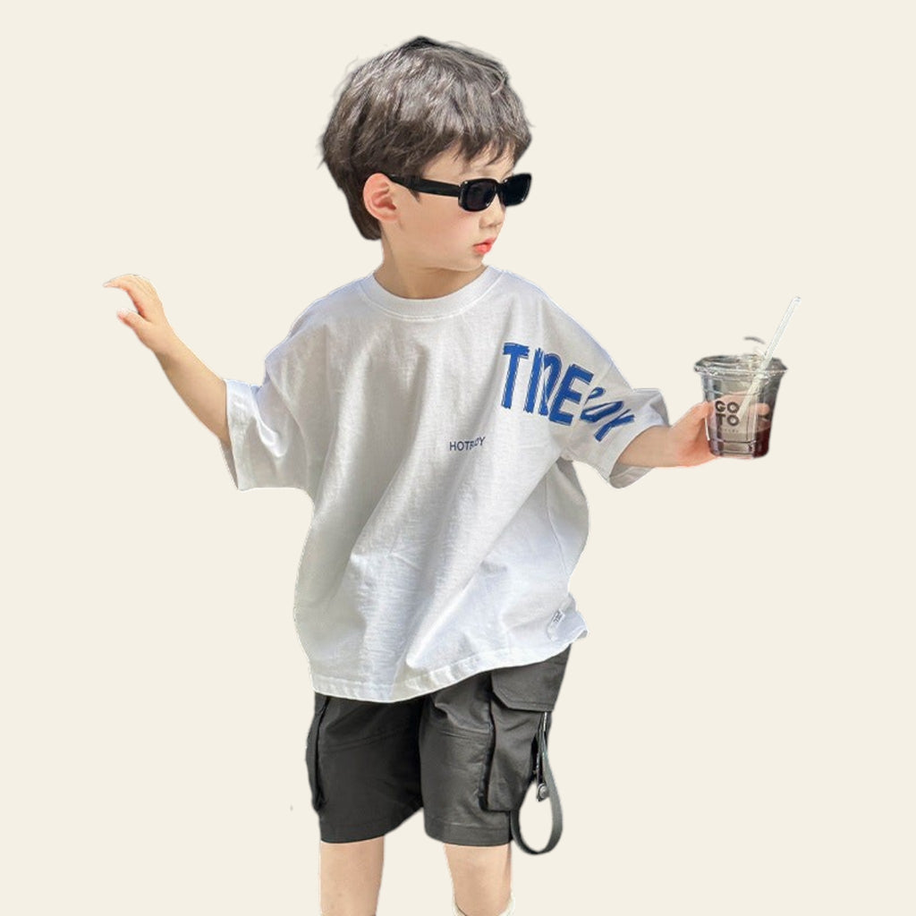 Child holding a drink and standing next to an open car door