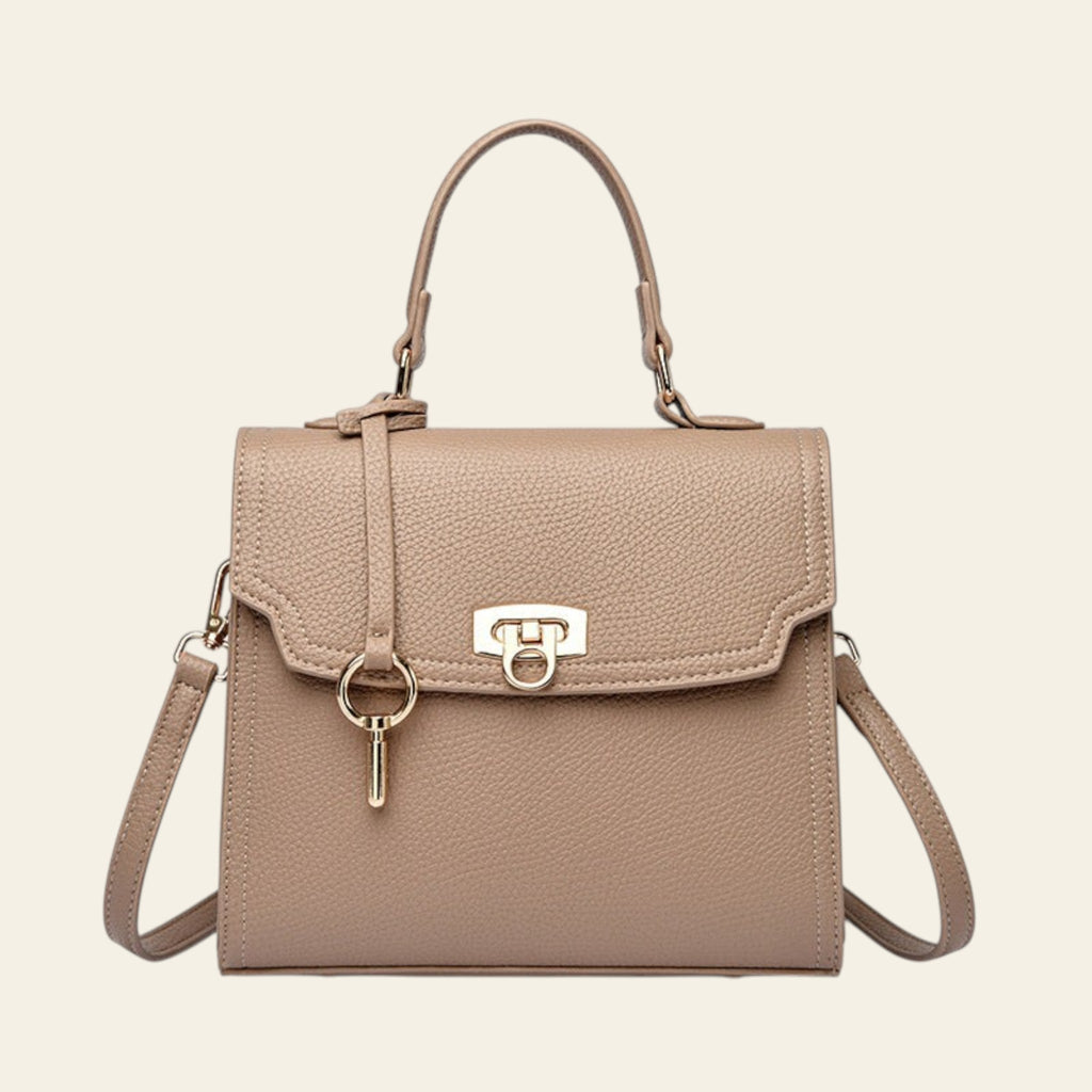Beige handbag with a gold lock on a white background