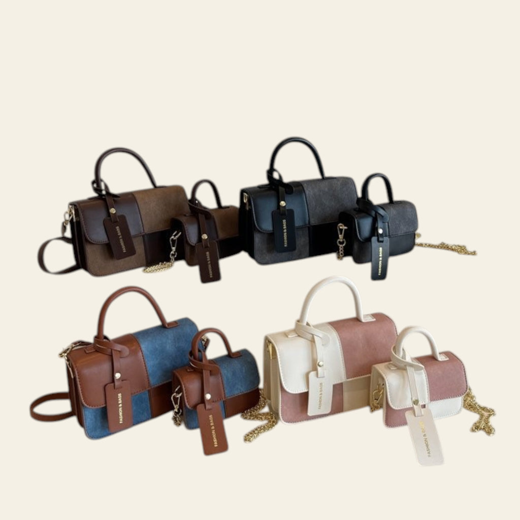Collection of handbags displayed on a shelf with a framed picture in the background.