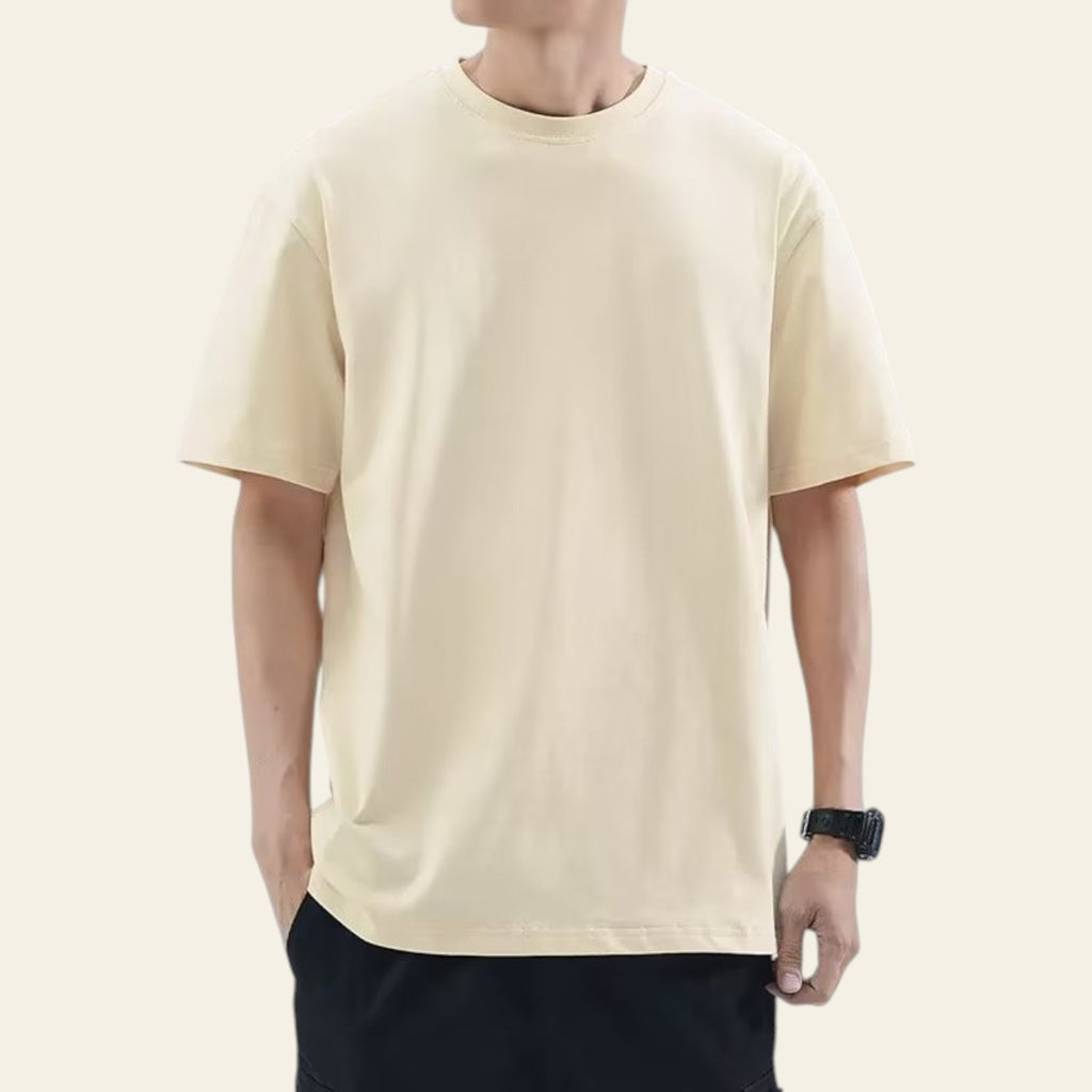 Man wearing an apricot loose fit solid color t-shirt