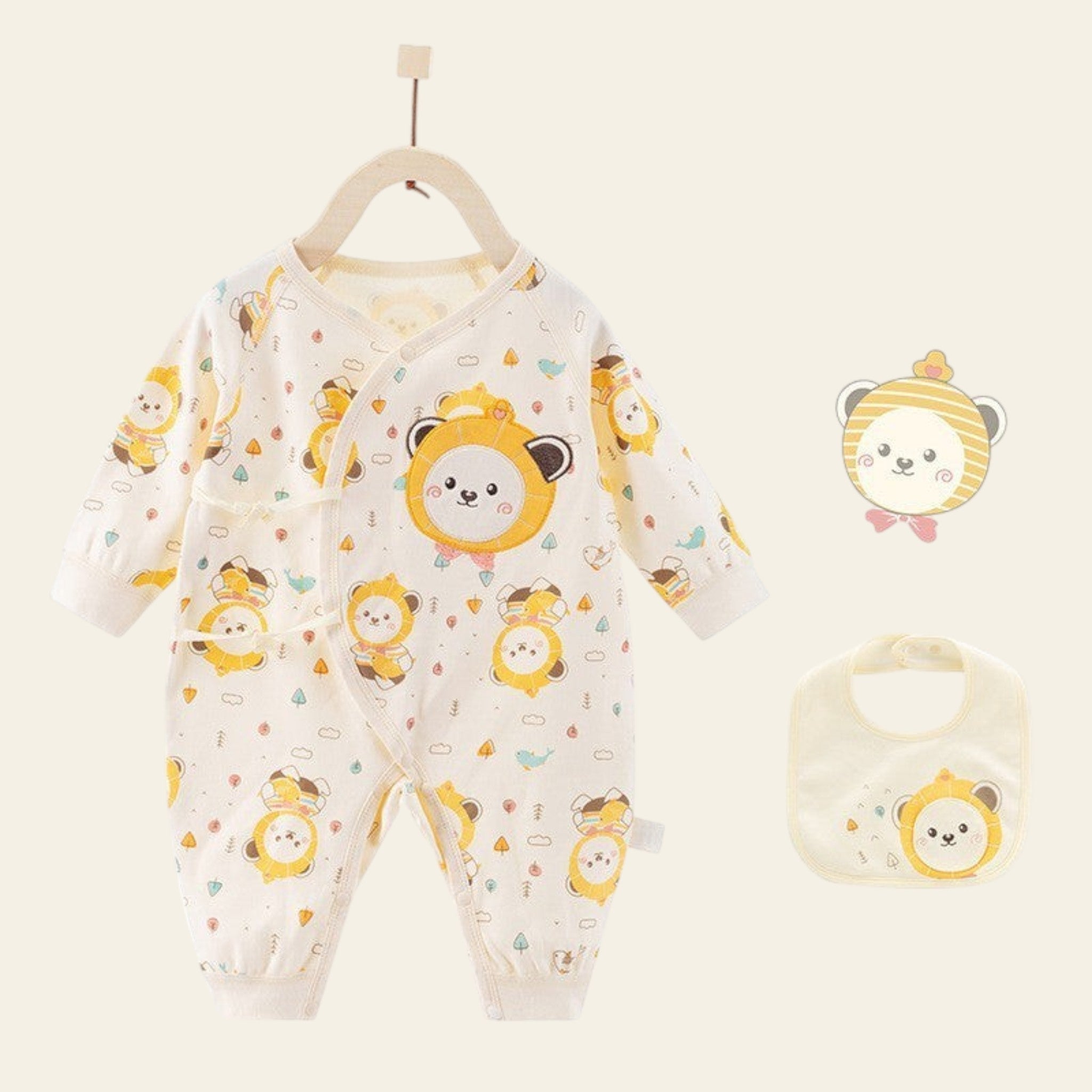 Baby romper with lion pattern and matching bib on a white background