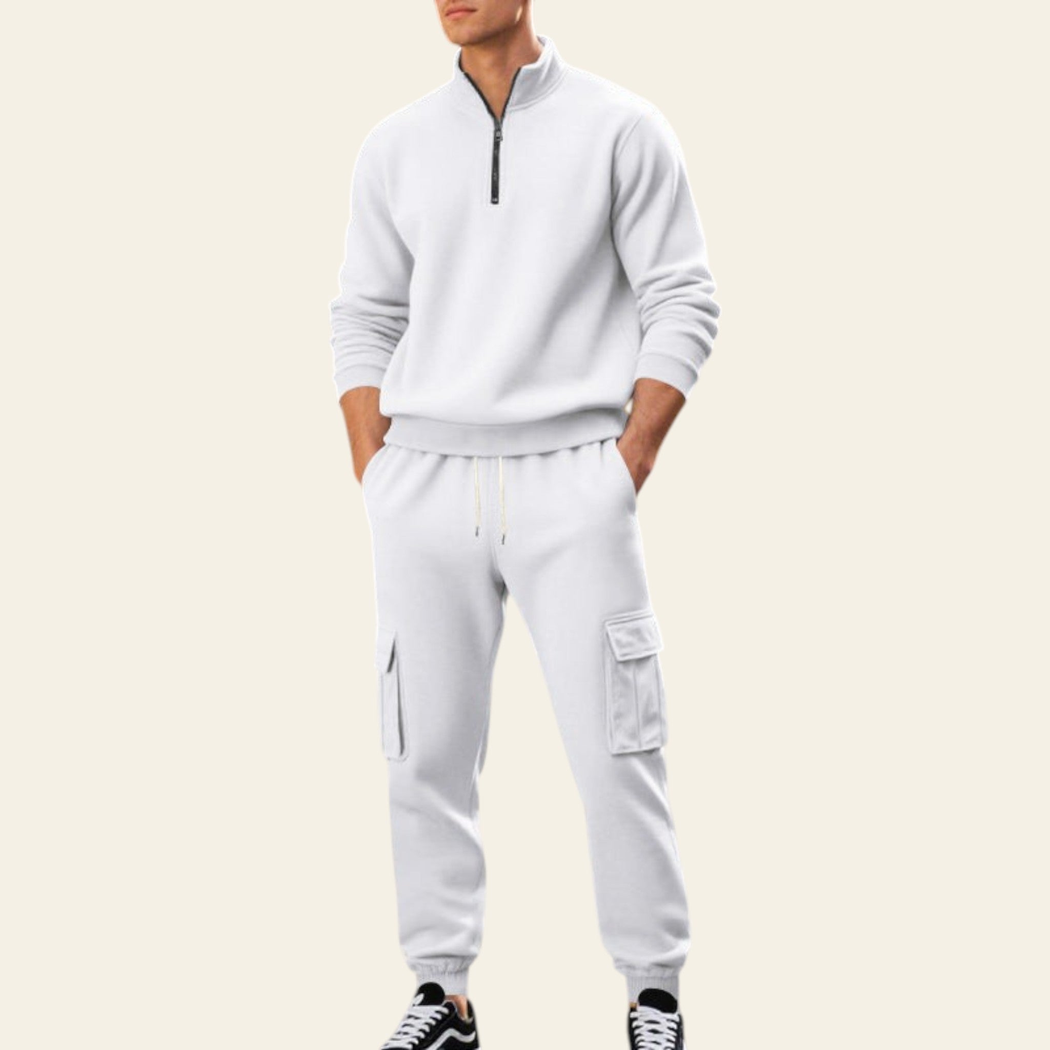 Man wearing a white fleece-lined tracksuit set with zip-up jacket and jogger pants on a city street