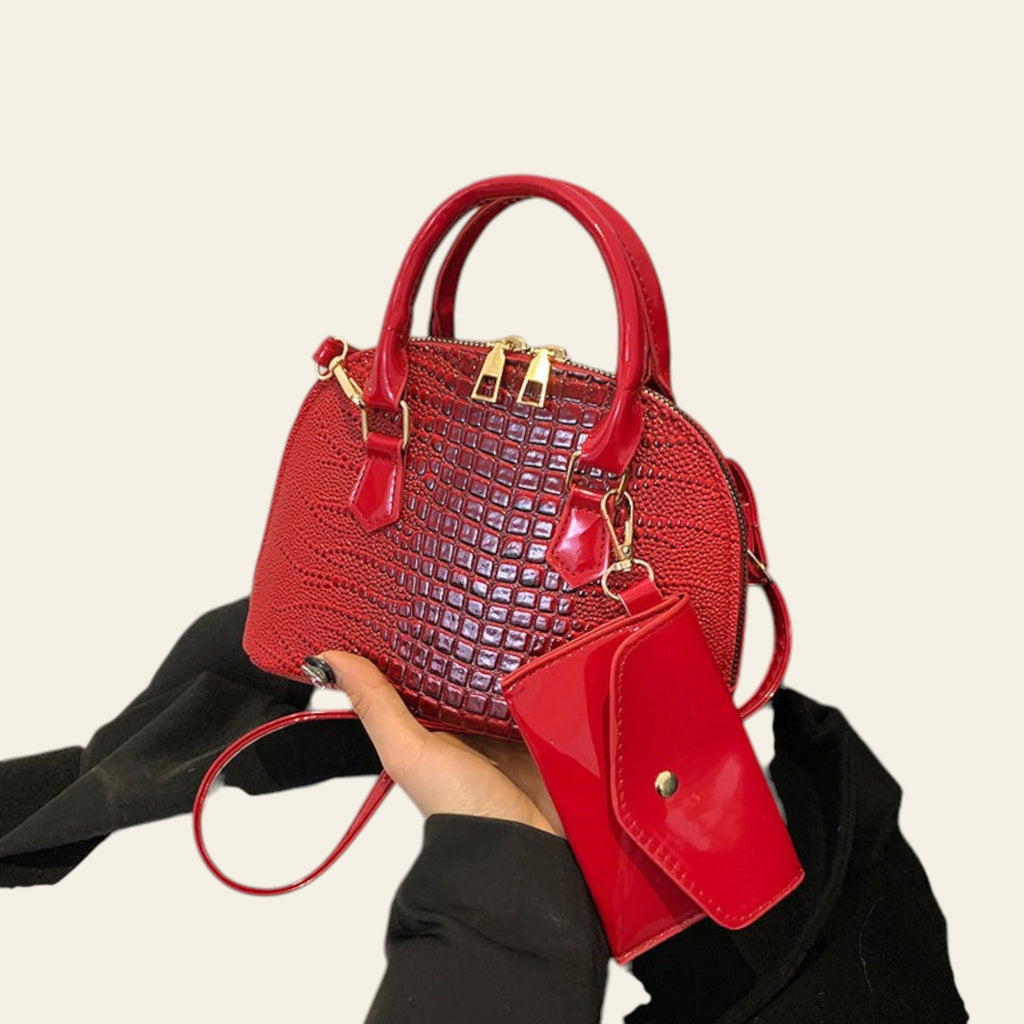 Wine red croc-textured satchel handbag with gold hardware and matching pouch
