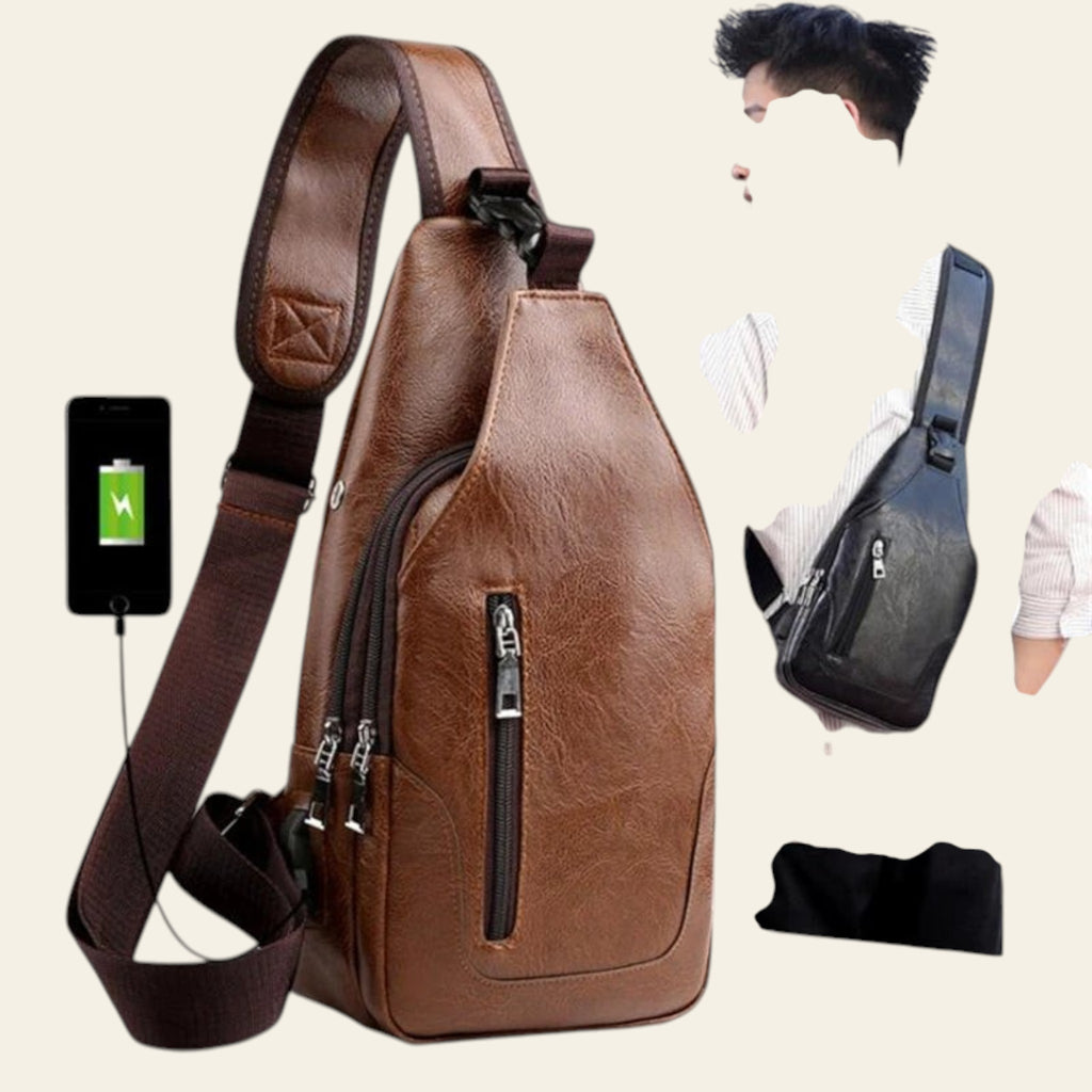 Brown leather sling bag with USB charging port and earbuds, displayed with a person wearing a black bag.