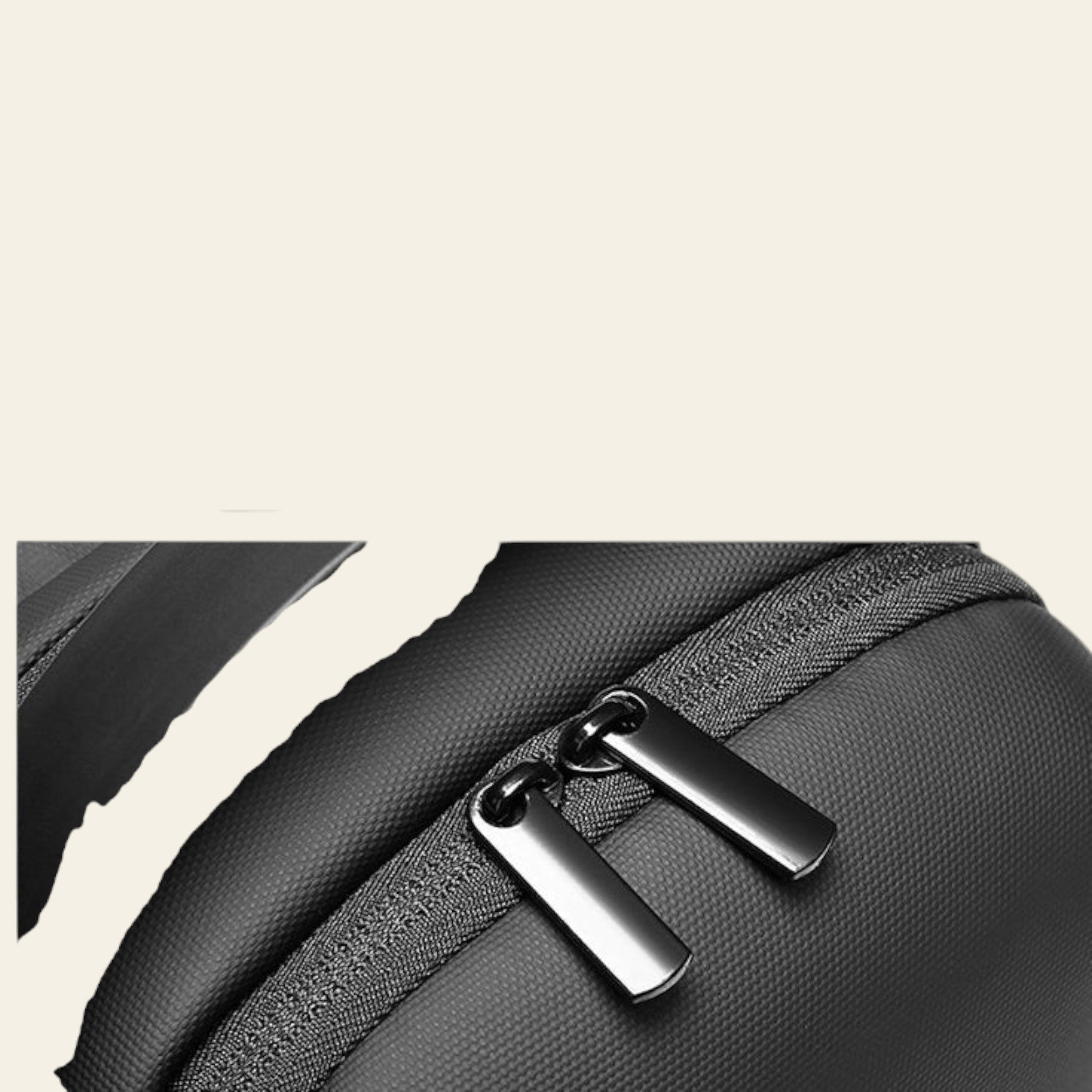 Close-up of a black backpack with zipper details