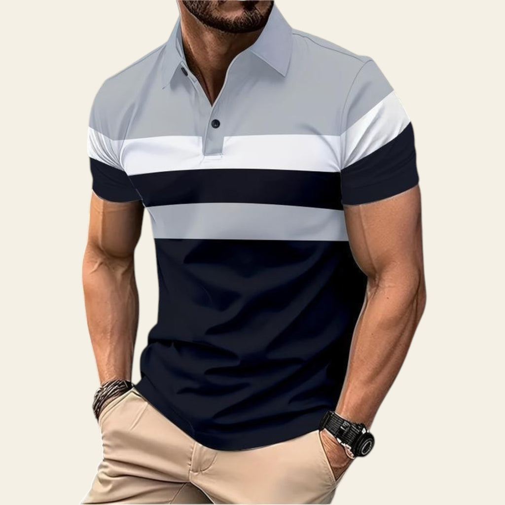 Man wearing a light blue, white, and navy striped polo shirt with short sleeve on a city street