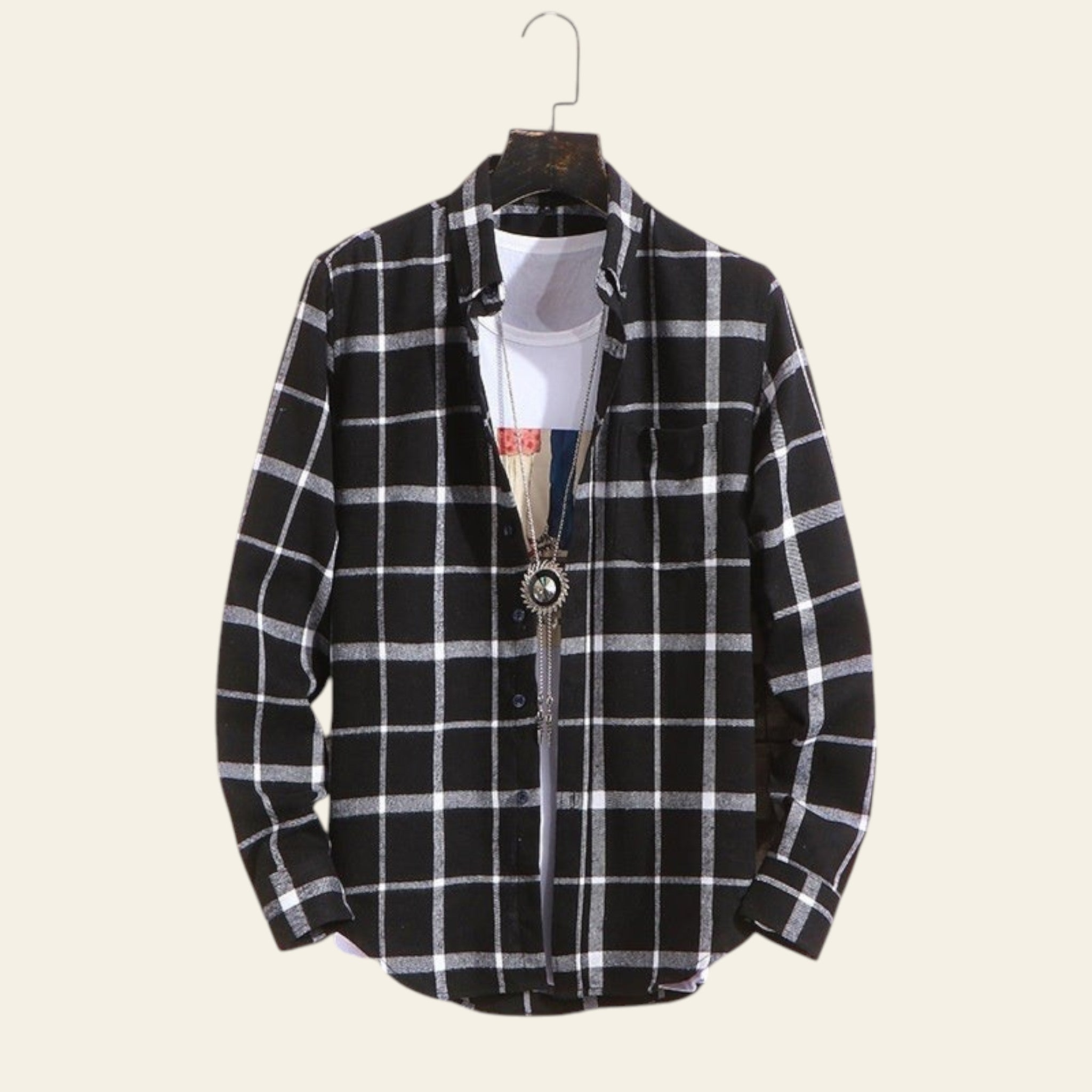 Black plaid men's long sleeve casual shirt hanging on wall
