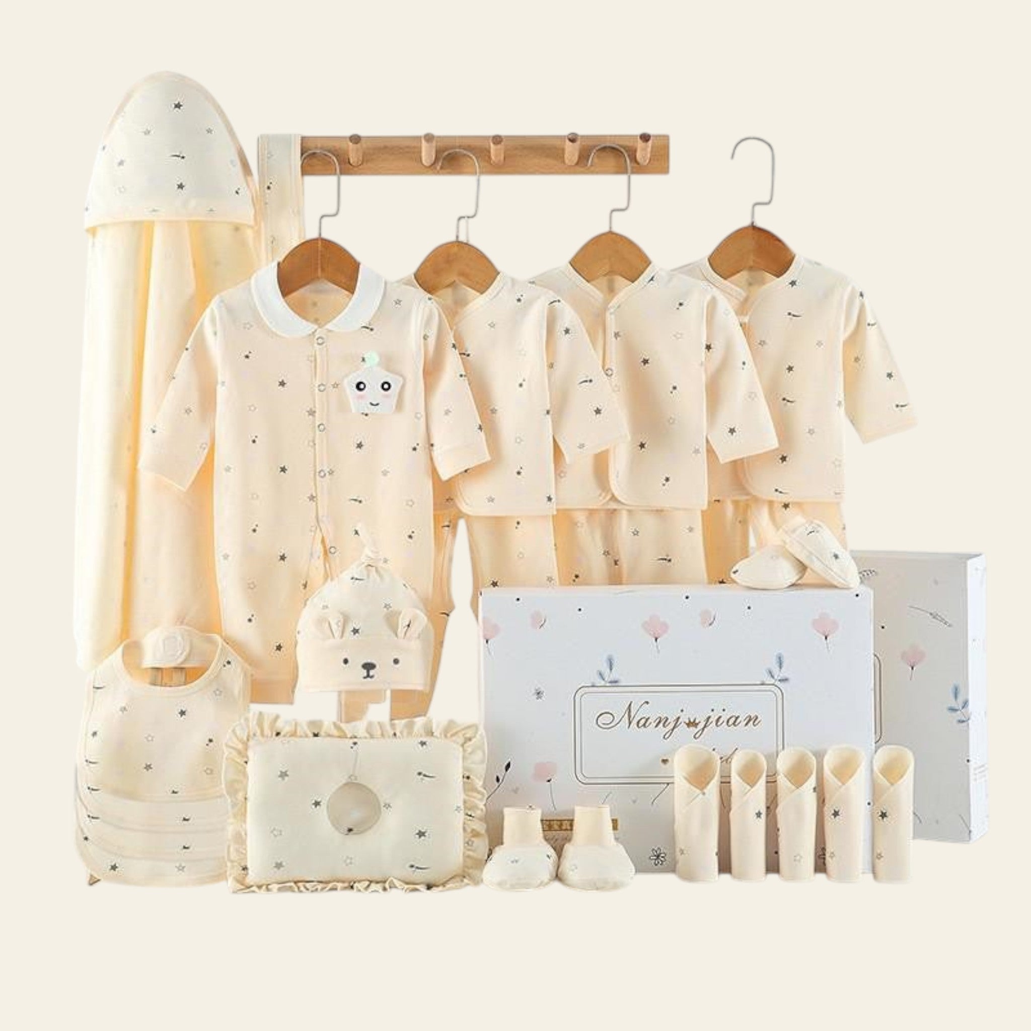 Baby clothing set with soft textures and a 'warm' label on a white background