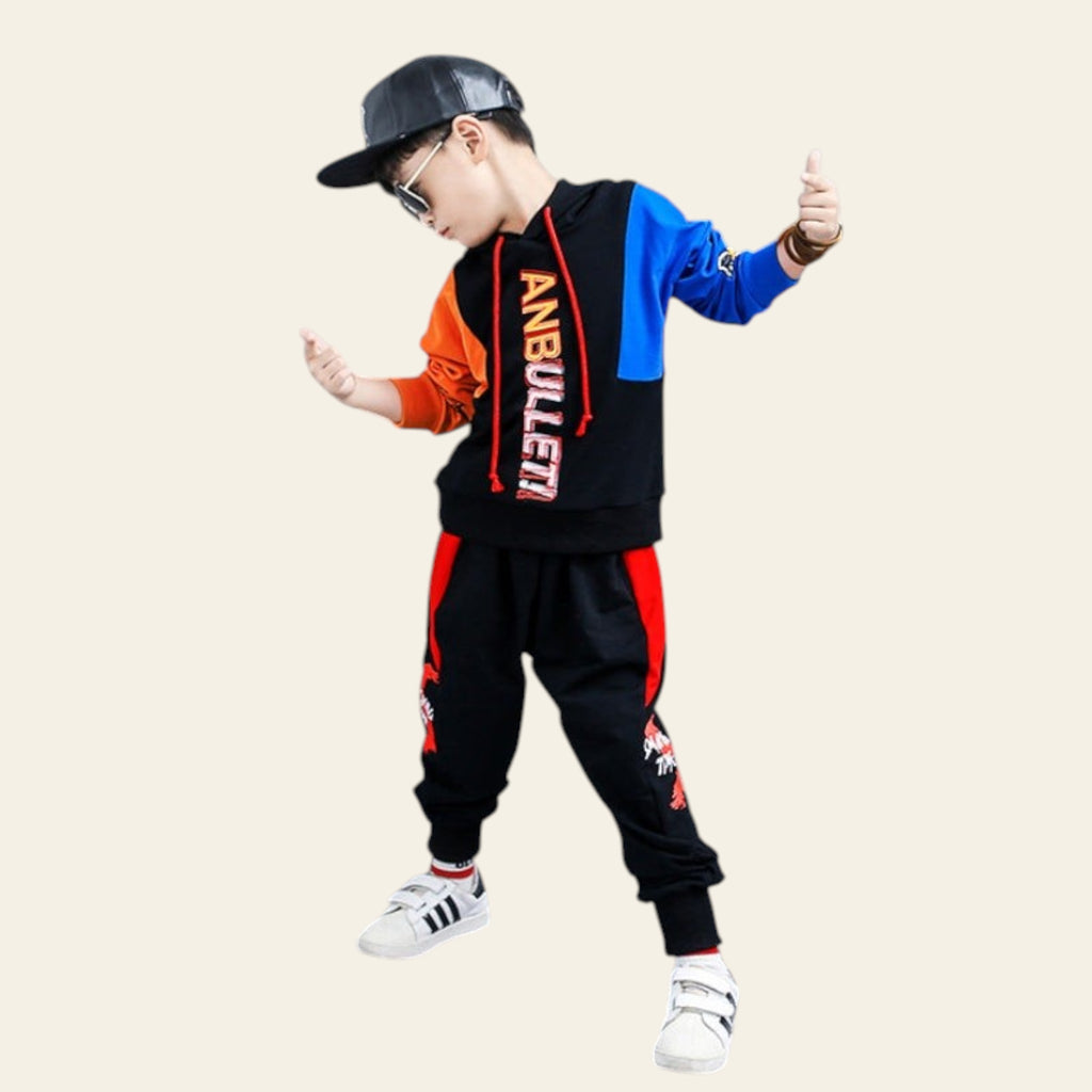 Child wearing a colorful outfit with 'ANBULLET' branding, standing against a gray background.