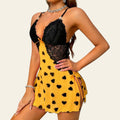 Woman wearing a sunflower yellow heart-print camisole nightgown dress (side view)