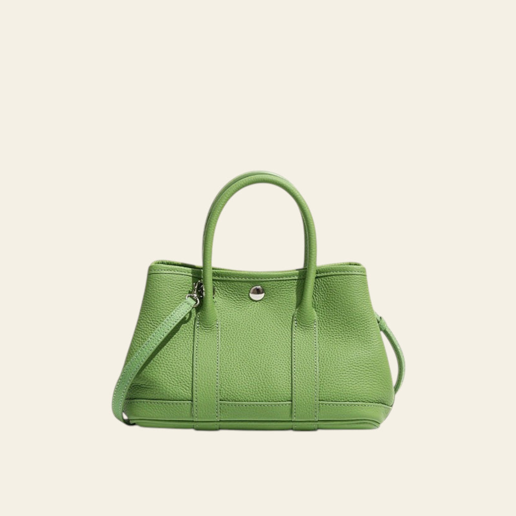 Green handbag on a white background