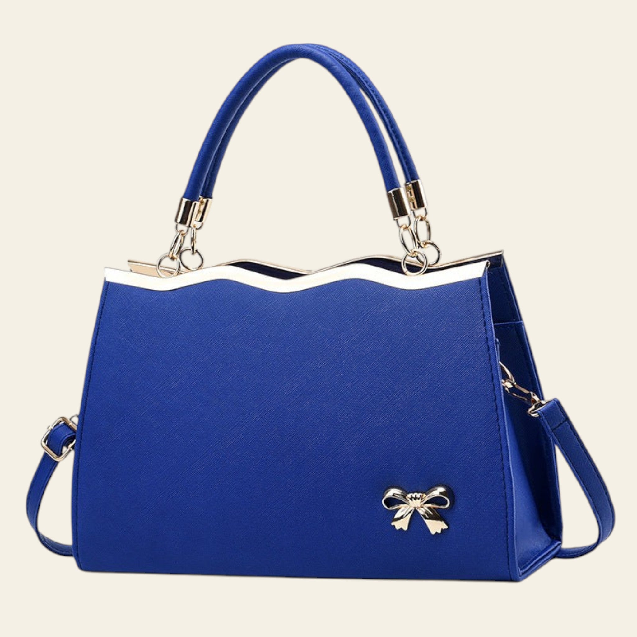 Blue handbag with a gold bow detail on a white background