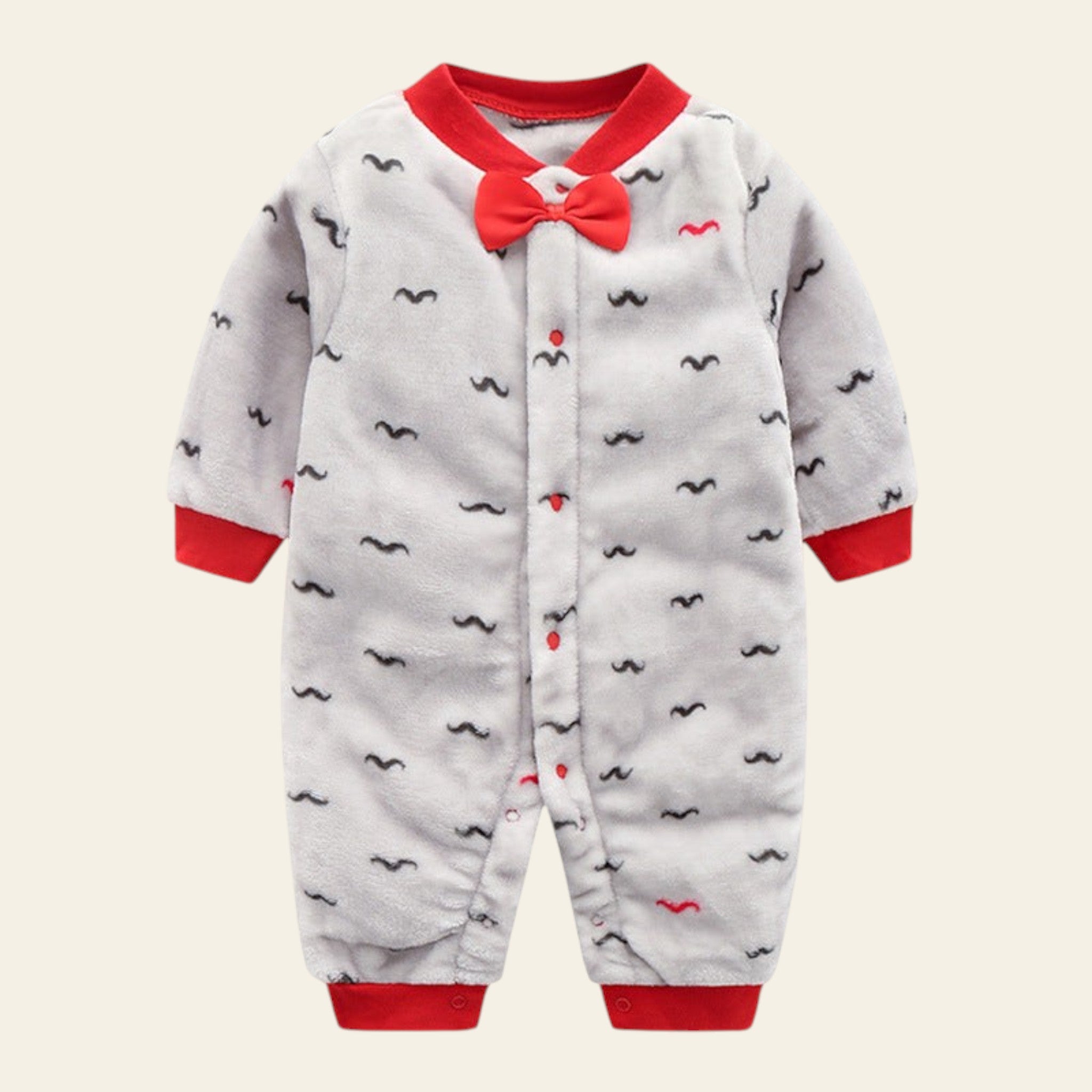 Baby onesie with red bow tie and mustache patterns on a white background
