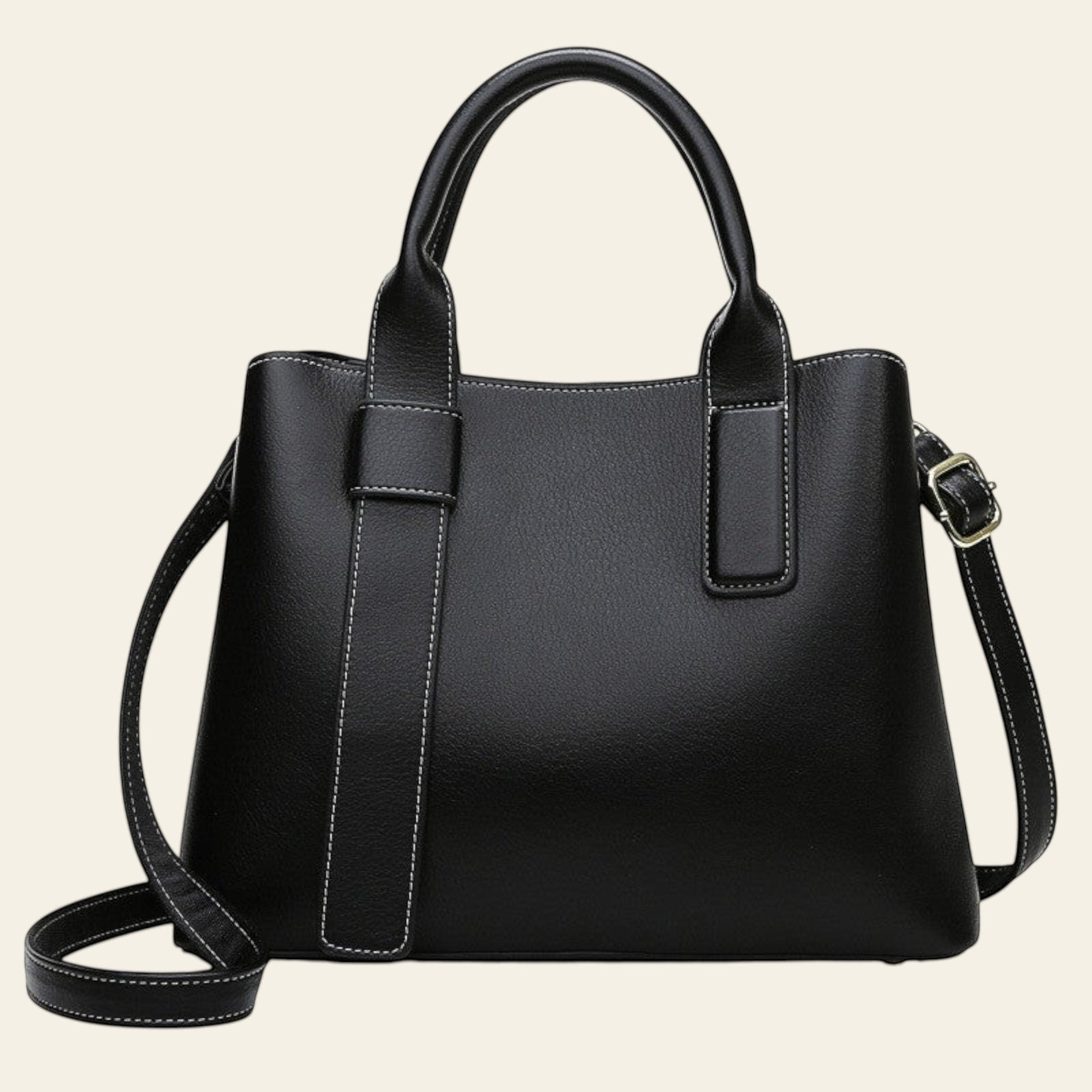 Black handbag with a shoulder strap on a white background