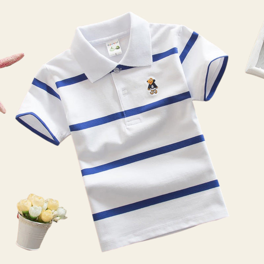 White polo shirt with blue stripes on a beige surface