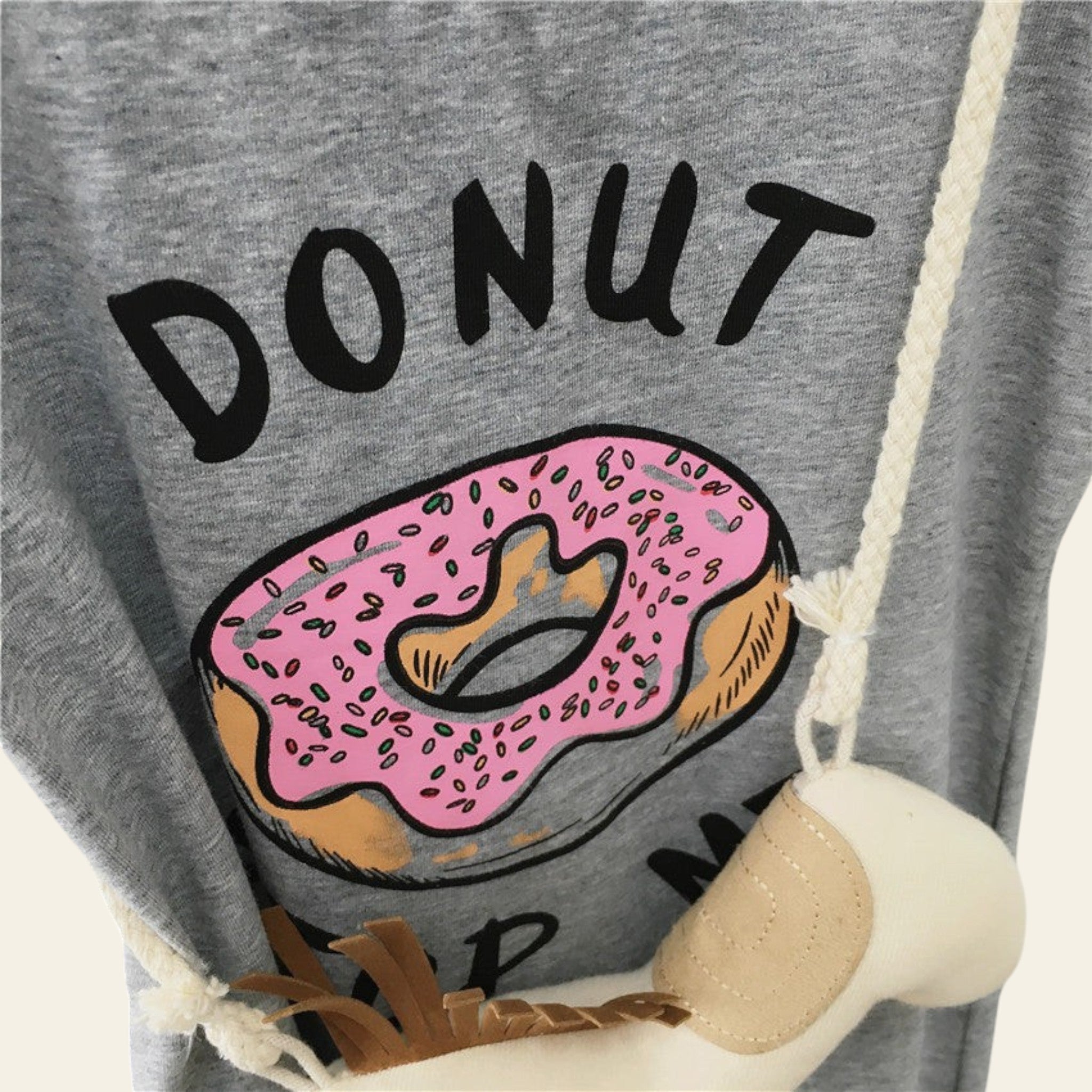 Gray sweatshirt with a donut graphic and 'DONUT' text on a swing.