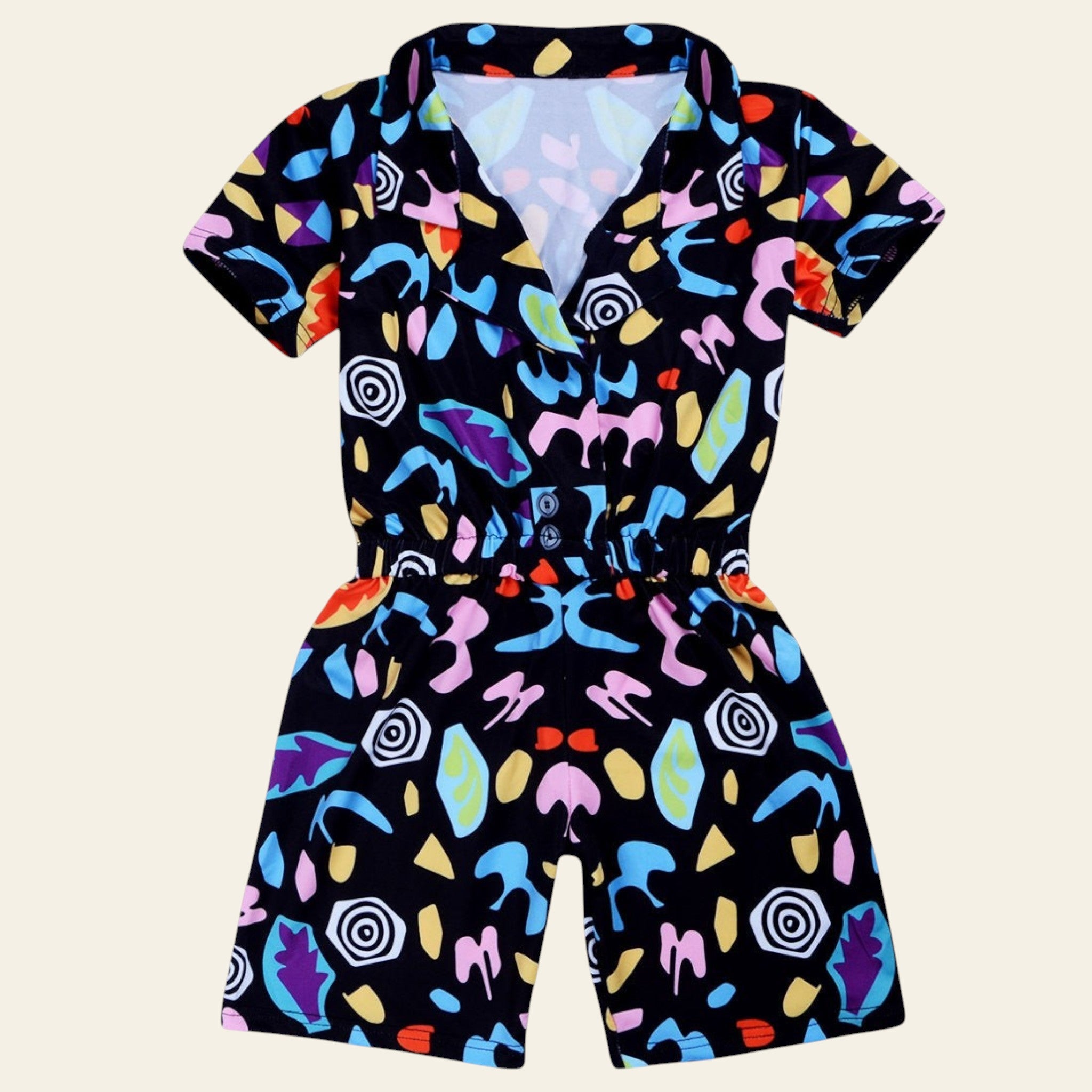 Colorful patterned romper on a white background