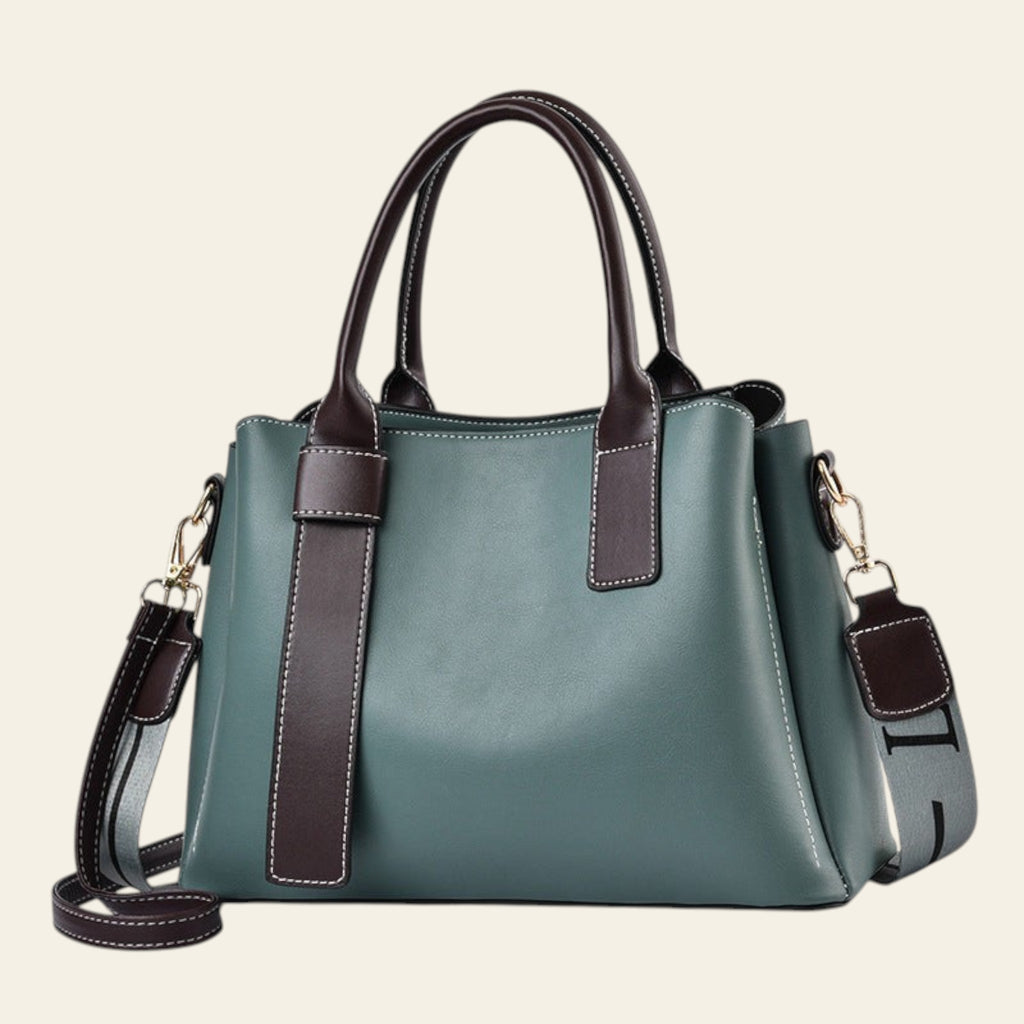 Green handbag with brown accents on a white background
