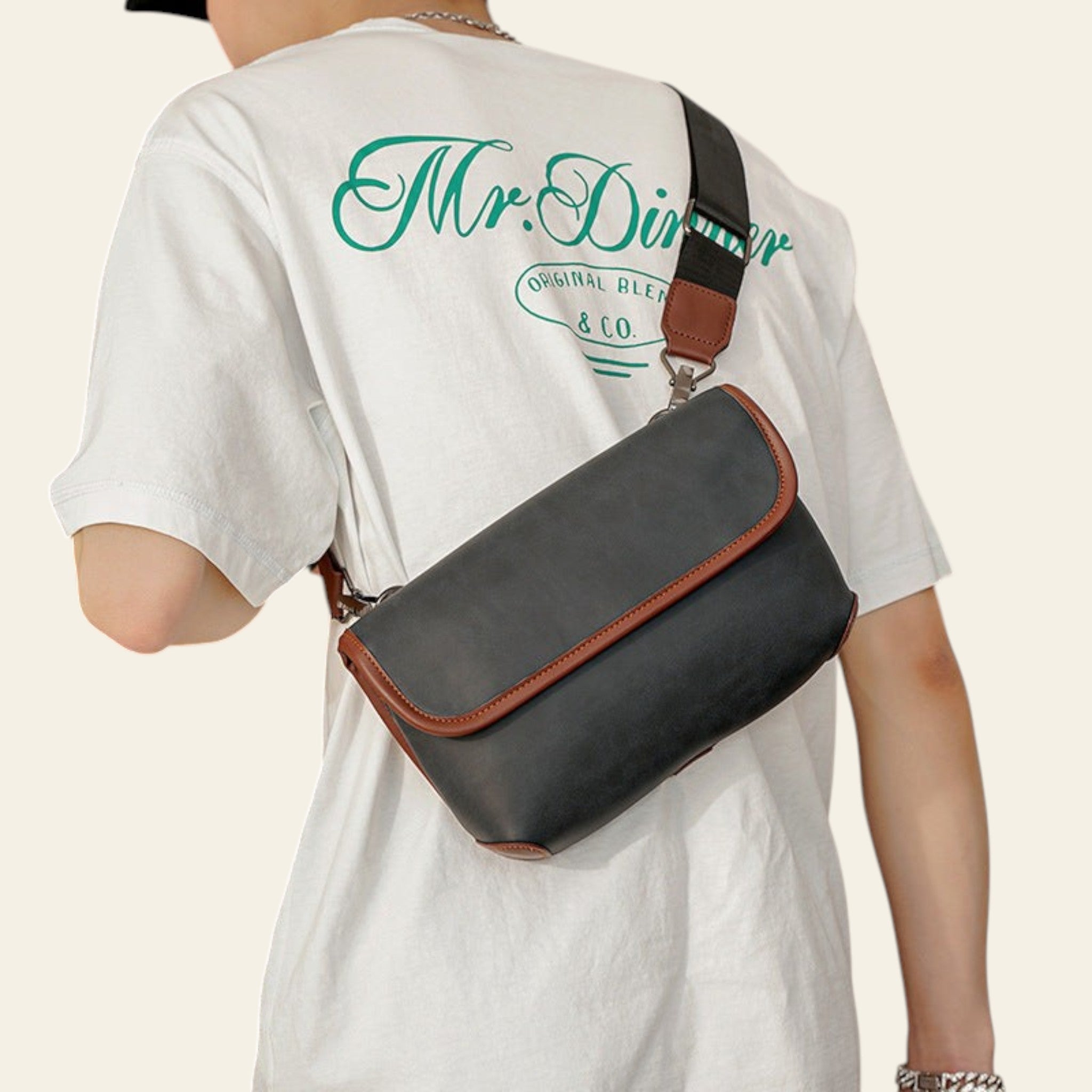 Person wearing a white t-shirt with 'Mr. Diner' branding and carrying a black crossbody bag.