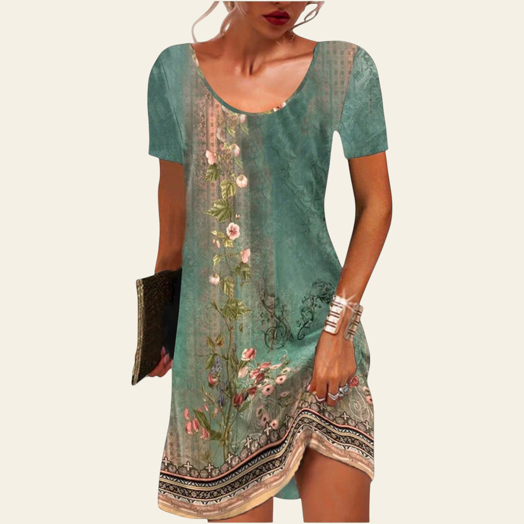 woman wearing a green floral short-sleeve summer dress with a relaxed fit