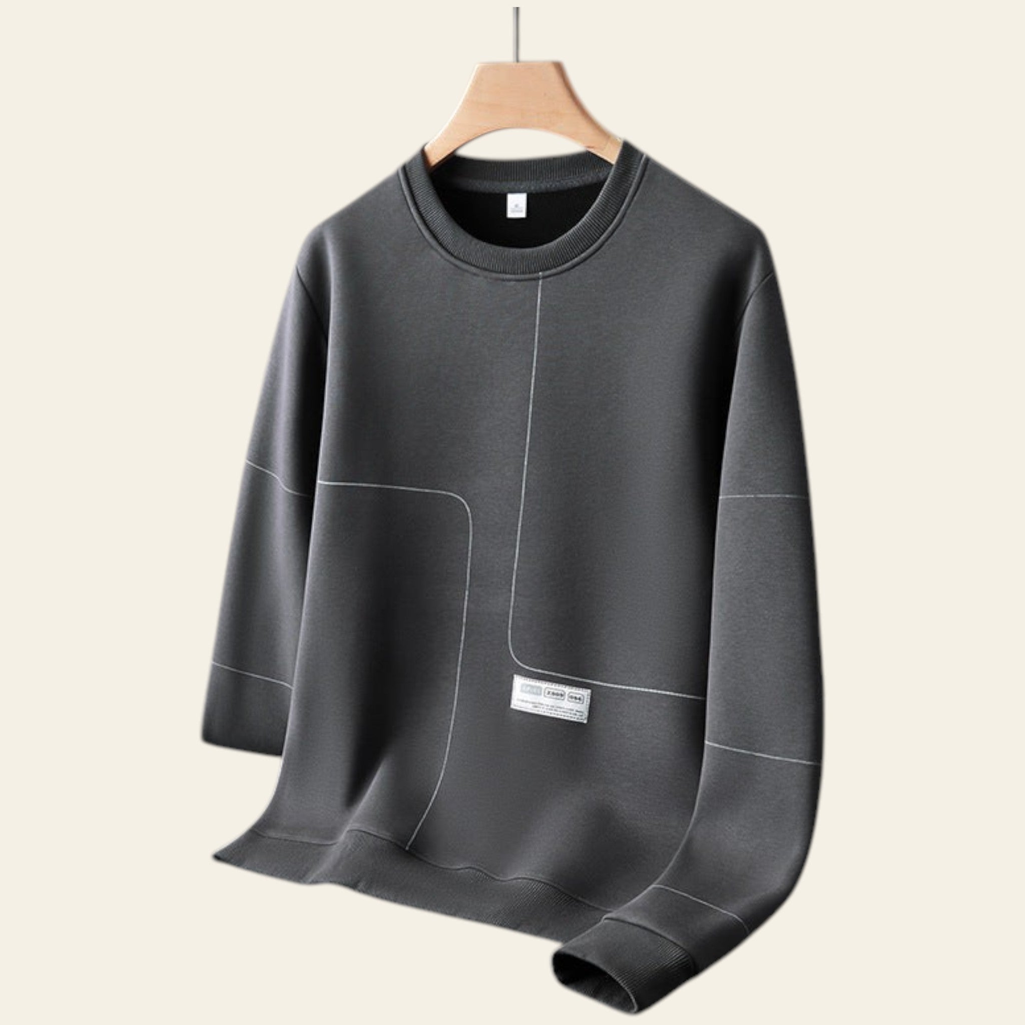 Gray crewneck pullover sweatshirt on a hanger against a gray background