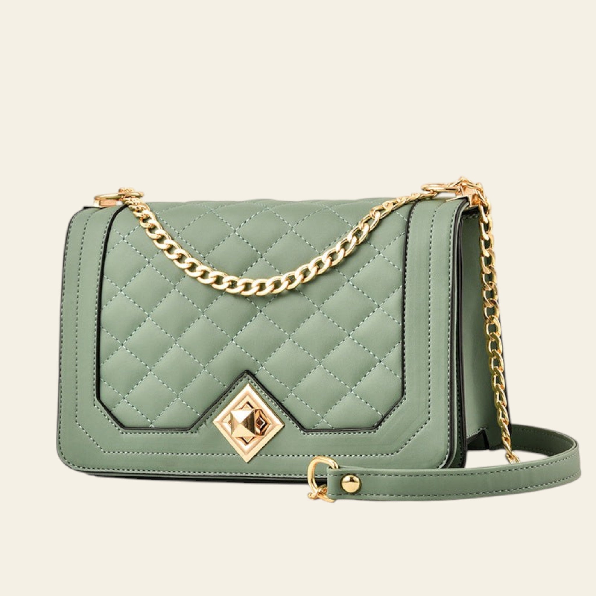 Green quilted handbag with gold chain strap on a white background