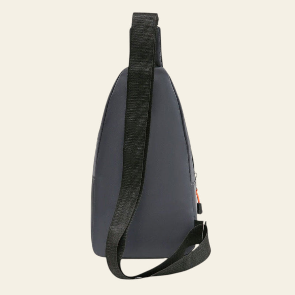 Gray sling bag with a black strap on a white background