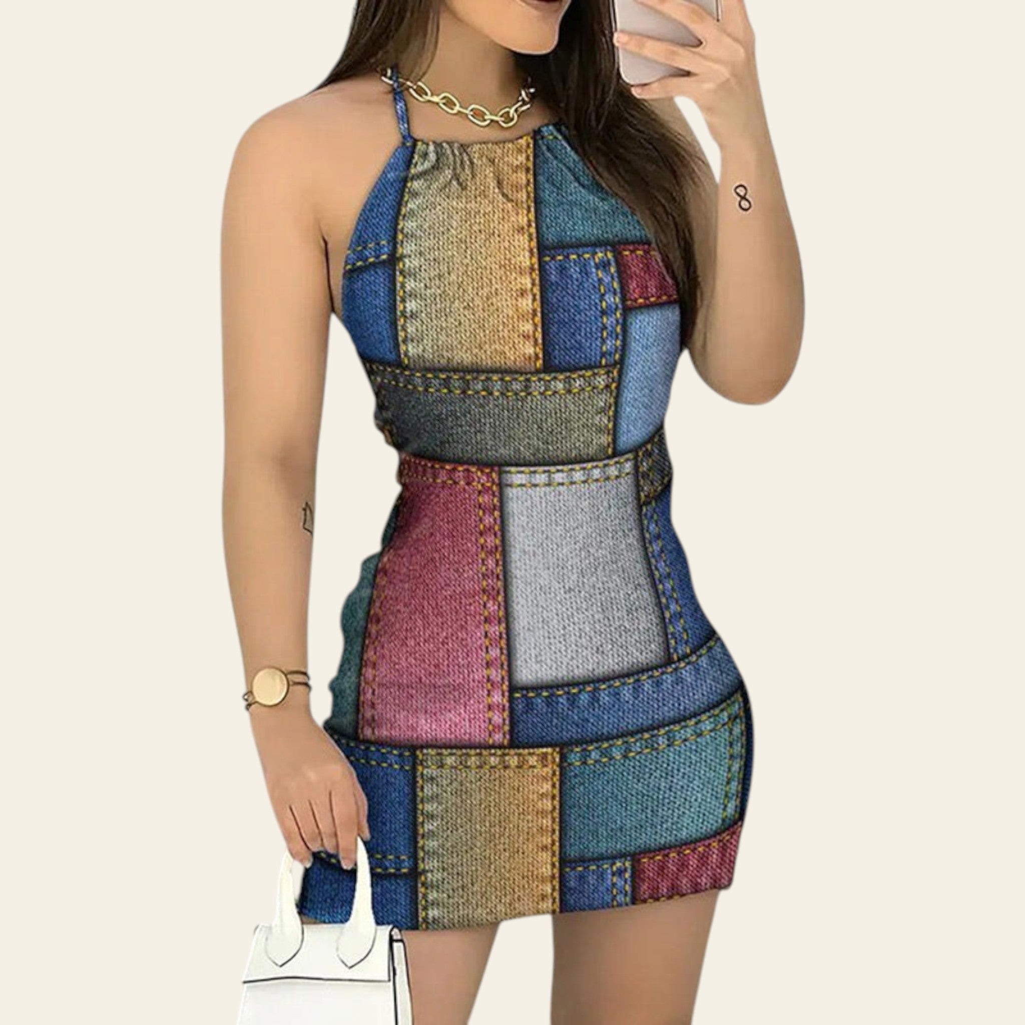 Woman wearing a multicolor patchwork denim halterneck backless mini dress
