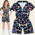 Colorful patterned romper with a model wearing it on a white background