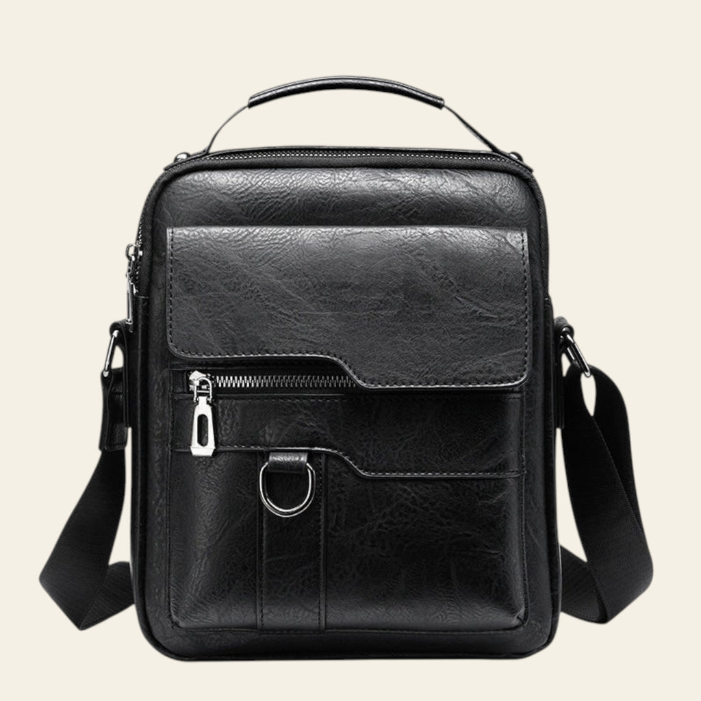 Black leather crossbody bag on a white background