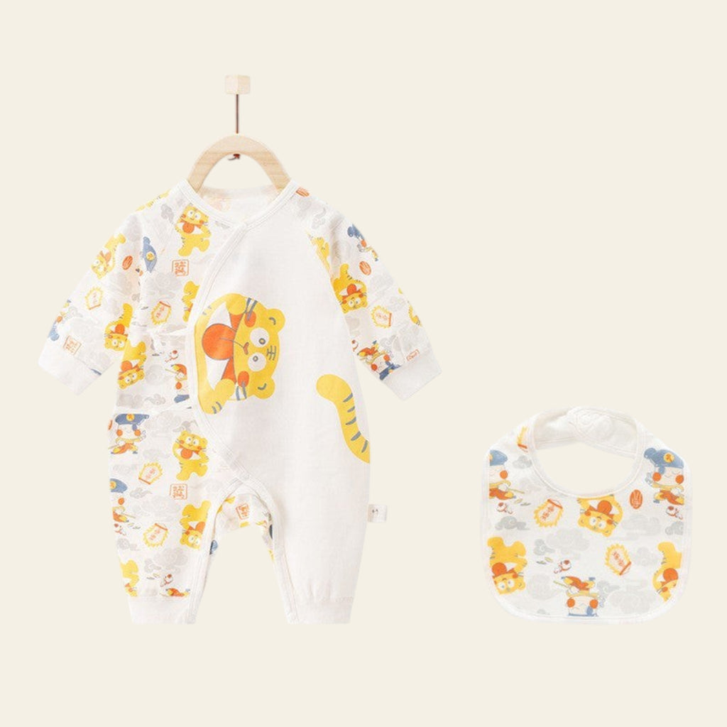 Baby onesie with cartoon designs on a hanger against a white background